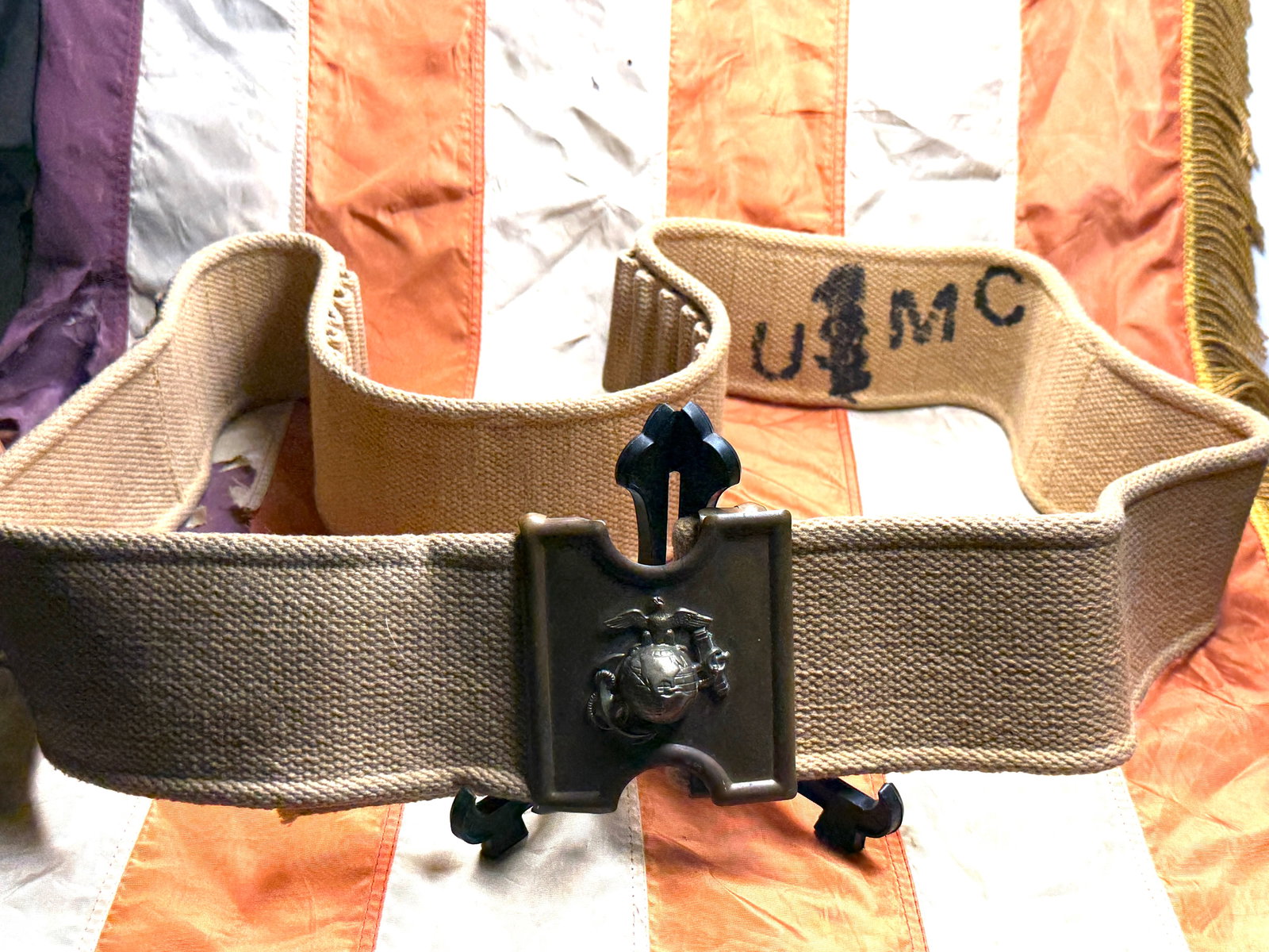 Civil War U.S. Marine Corps Cartridge Belt and Eagle, Globe & Anchor Plate: This woven canvas cartridge belt is fitted with a brass belt plate bearing the Eagle, Globe, and Anchor, the emblem of the United States Marine Corps. The belt plate is stamped on the reverse with the