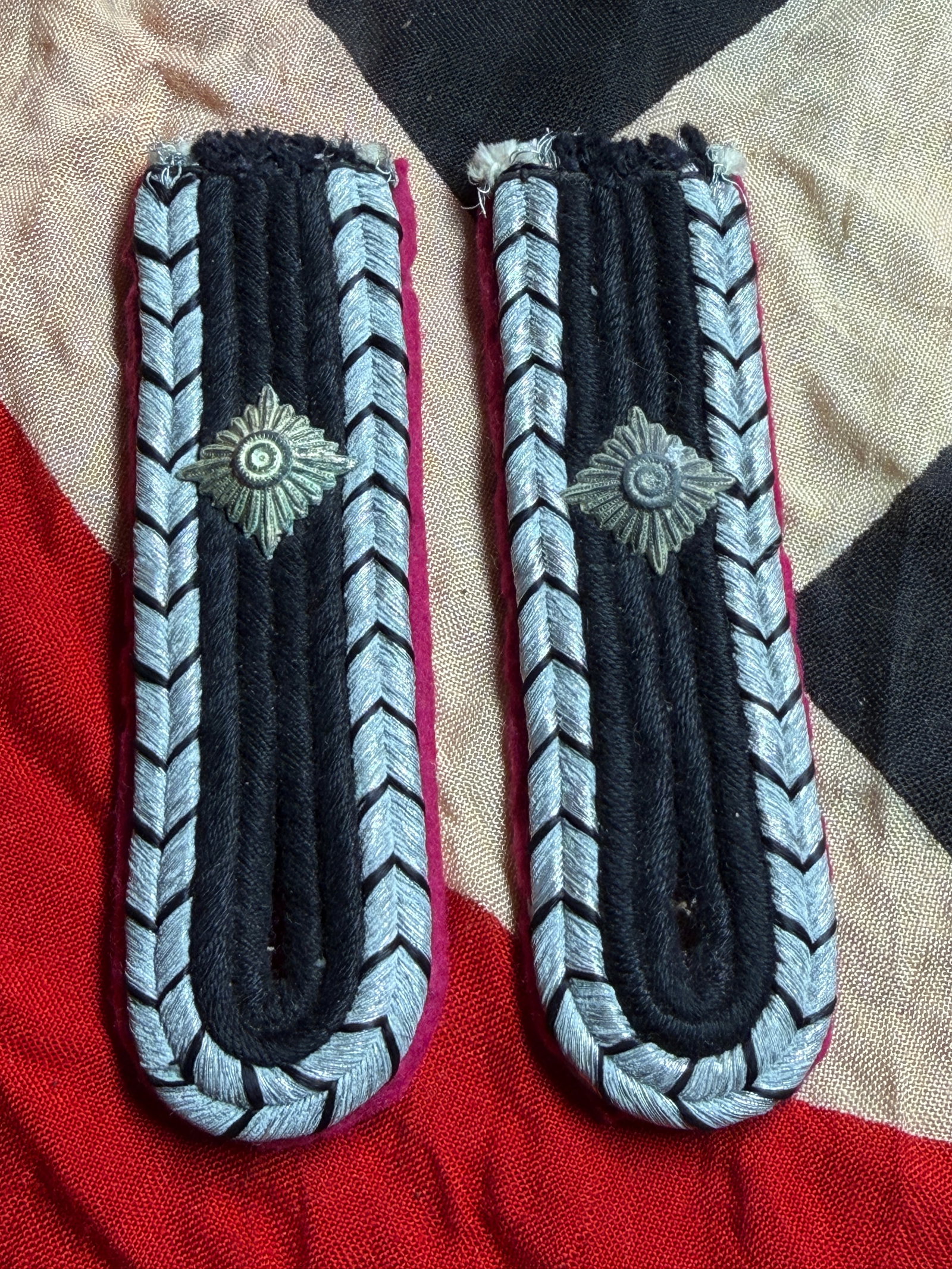 WW2 German Feuerschutzpolizei Non-Commissioned Officer Shoulder Boards (Pair): This matched pair of shoulder boards was worn by a non-commissioned officer of the German Fire Police (Feuerschutzpolizei) during the Second World War. The boards feature a black wool base bordered by