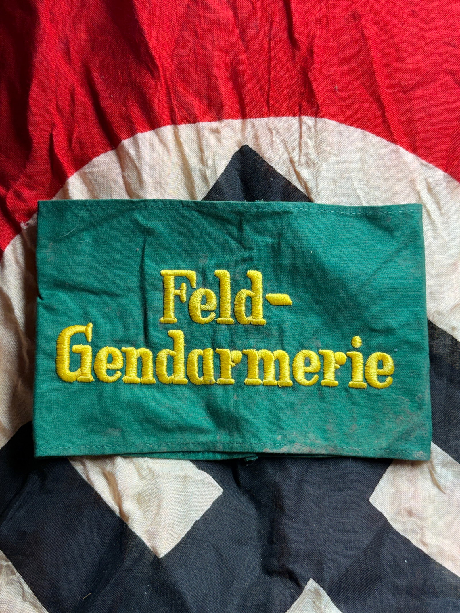 WW2 German Feldgendarmerie Armband (Field Gendarmerie Identification Band): This textile armband is identified as a Feldgendarmerie armband, worn by members of the German Field Gendarmerie, the military police of the Wehrmacht during the Second World War. Constructed from gre