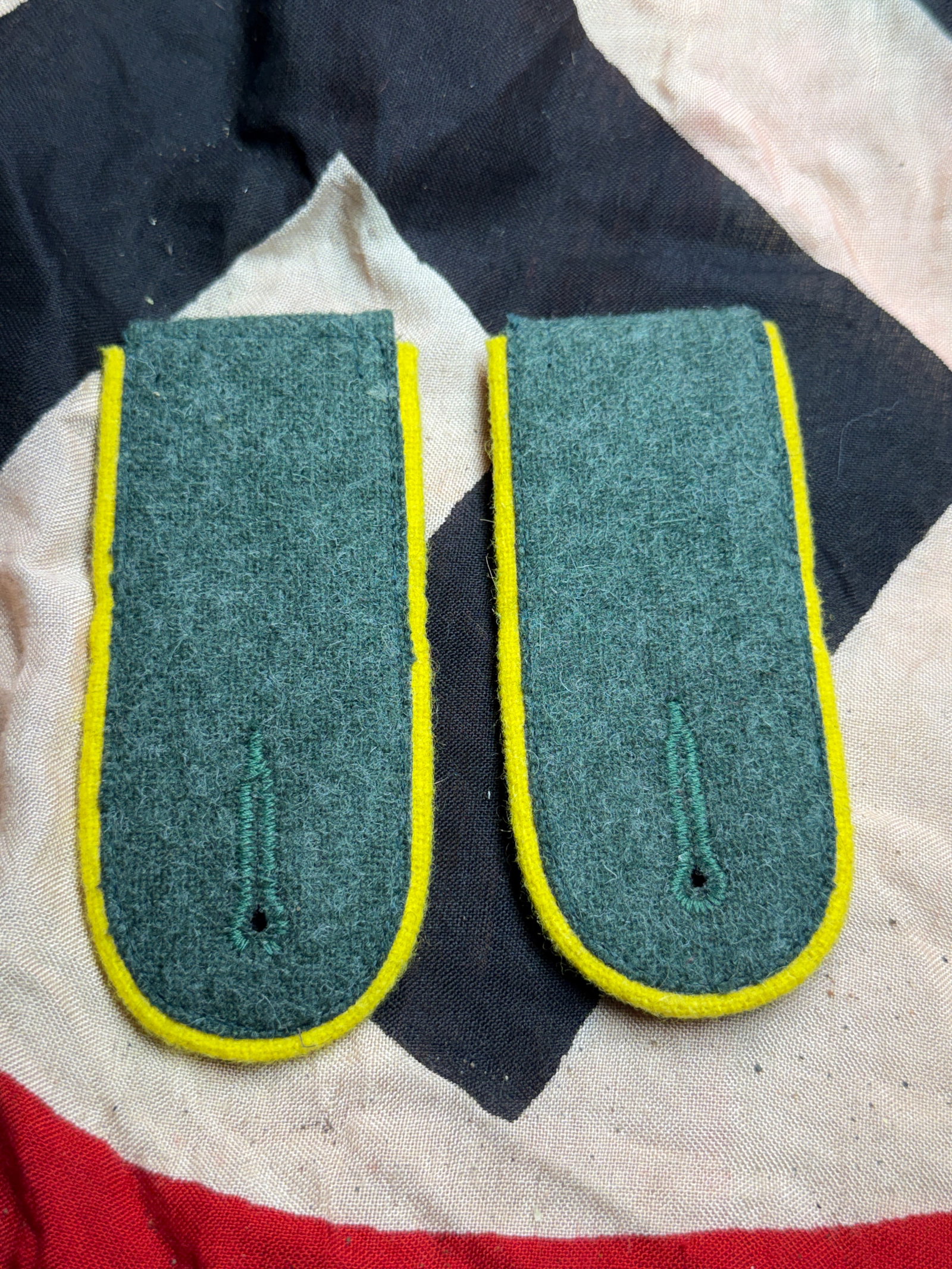WW2 Pair of Wehrmacht Infantry Shoulder Boards (Slip-On Type): This matched pair of slip-on shoulder boards was worn by enlisted personnel of the German Army (Wehrmacht) during the Second World War. Constructed from field-gray wool with yellow piping (Waffenfarbe