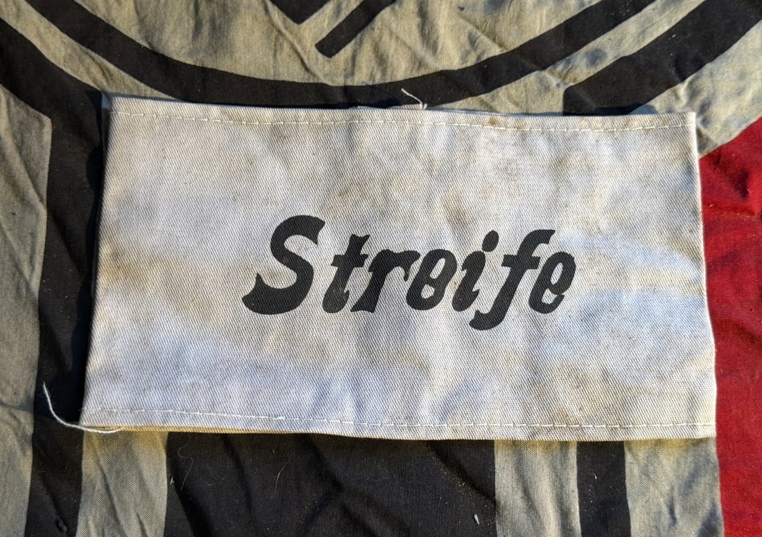 WW2 “Streife?? Identification Armband (Patrol/Guard Duty): This cloth armband bears the printed word “Streife” (German for patrol), identifying the wearer as assigned to patrol or guard duties. Such armbands were used in Nazi Germany during the Second