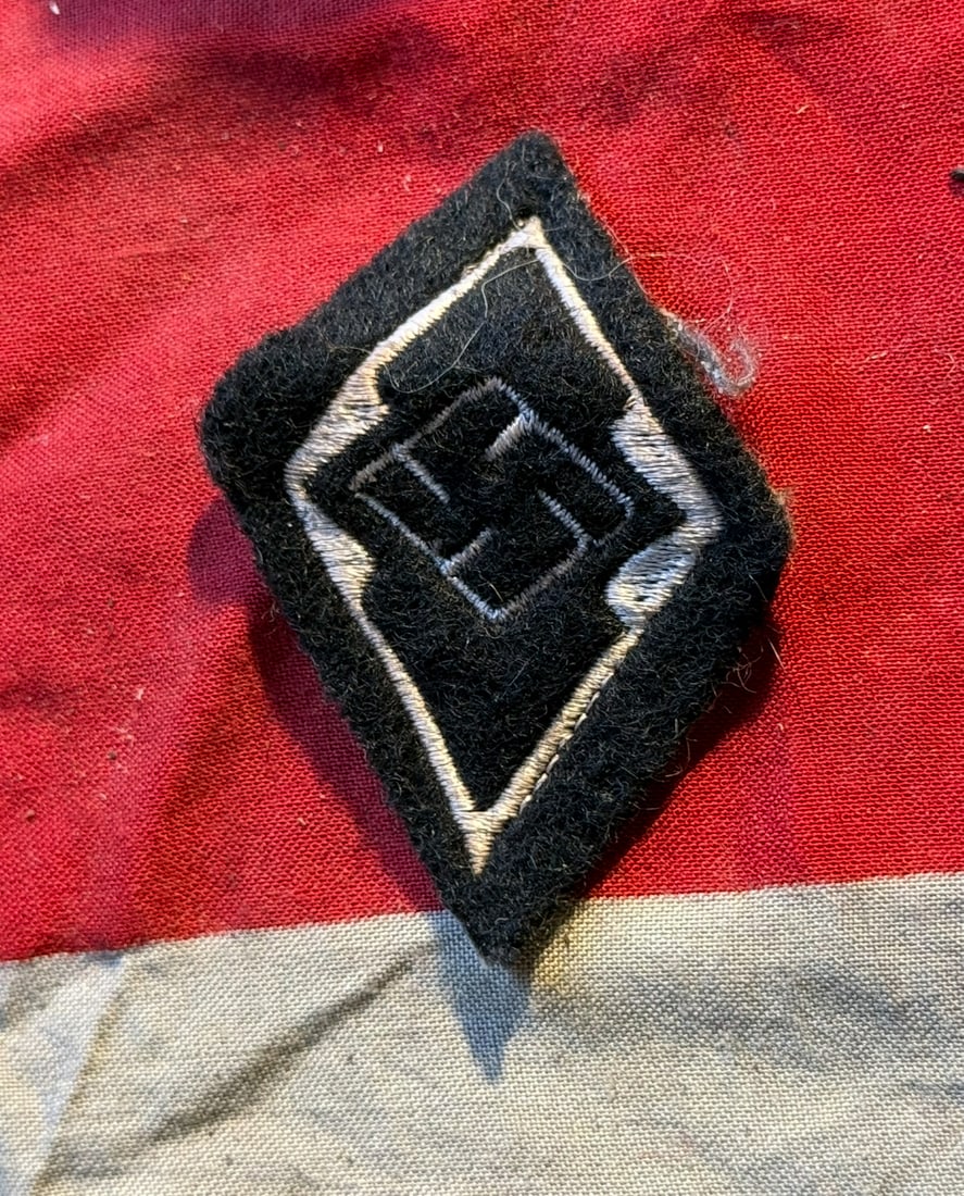 WW2 Waffen-SS Former Hitler Youth Member’s Sleeve Diamond (Voriges Mitglied der HJ) With RZM Paper: WW2 Waffen-SS Former Hitler Youth Member’s Sleeve Diamond (Voriges Mitglied der HJ) With RZM Paper TAG. A RARE FIND. SHOWS GOOD WEAR AND USE WITH A BEAUTIUL OVERALL PATINA. PLEASE VIEW ALL DETAILED