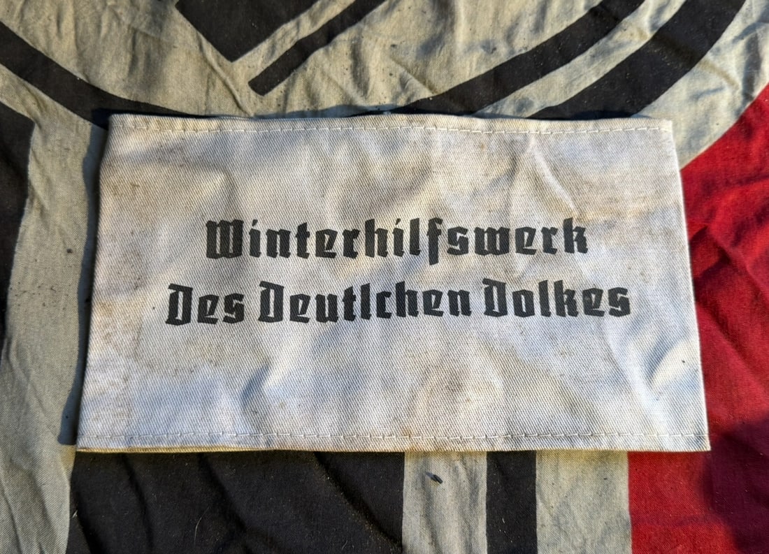 WW2 Winterhilfswerk des Deutschen Volkes Armband (Winter Relief Organization Armband): This armband was issued by the Winterhilfswerk des Deutschen Volkes (Winter Relief of the German People), a nationwide charitable organization operating in Nazi Germany from 1933 to 1945. The Winterhi