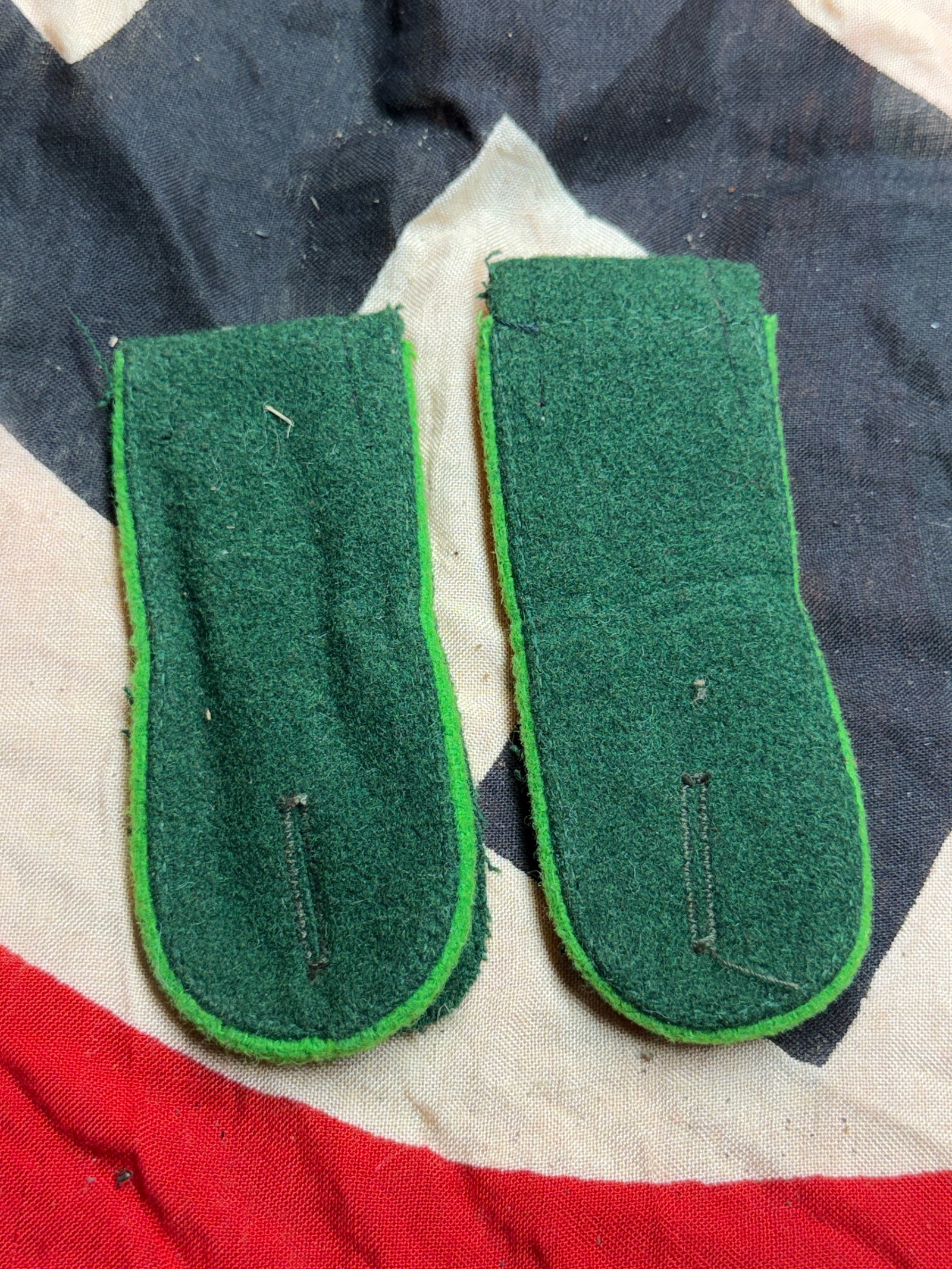 WW2 German German Army (Heer) M36 Enlisted Shoulder Boards for Panzergrenadier or Jäger Units: This matched pair of German Army (Heer) enlisted shoulder boards dates to the M36 uniform pattern period of World War II. Constructed from dark green wool with a lighter green Waffenfarbe underlay, th
