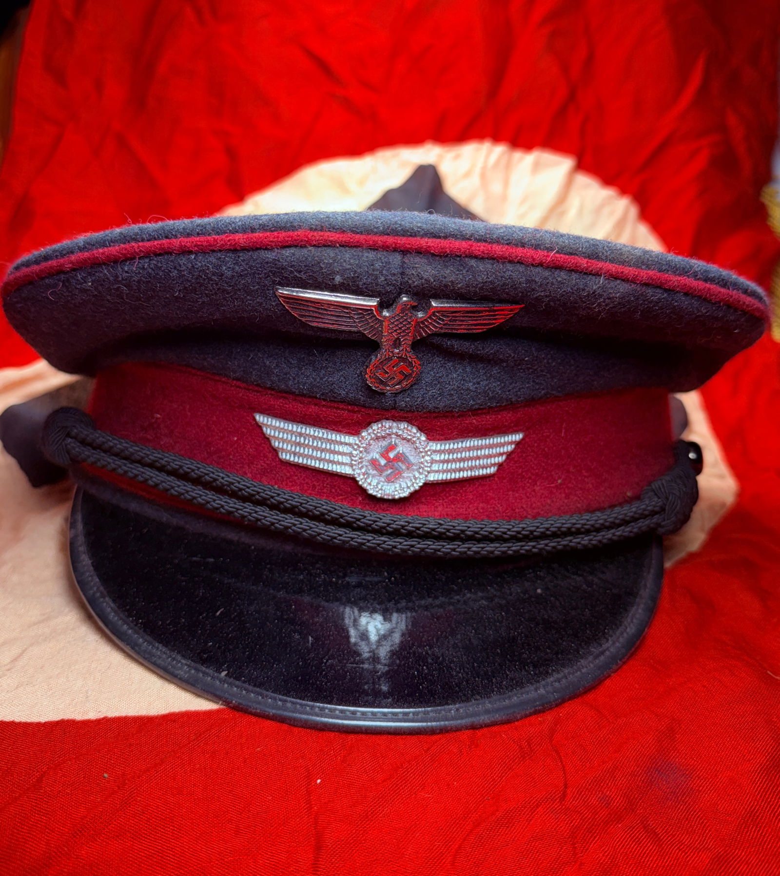 German WWII Luftwaffe Civil Fire Brigade NCO Visor Cap (Schirmmütze), c. 1939–1945: This visor cap (Schirmmütze) belonged to a non-commissioned officer (NCO) of the Luftwaffe Civil Fire Brigade (Luftwaffen-Feuerlöschdienst) during the Second World War. The cap is constructed of dar