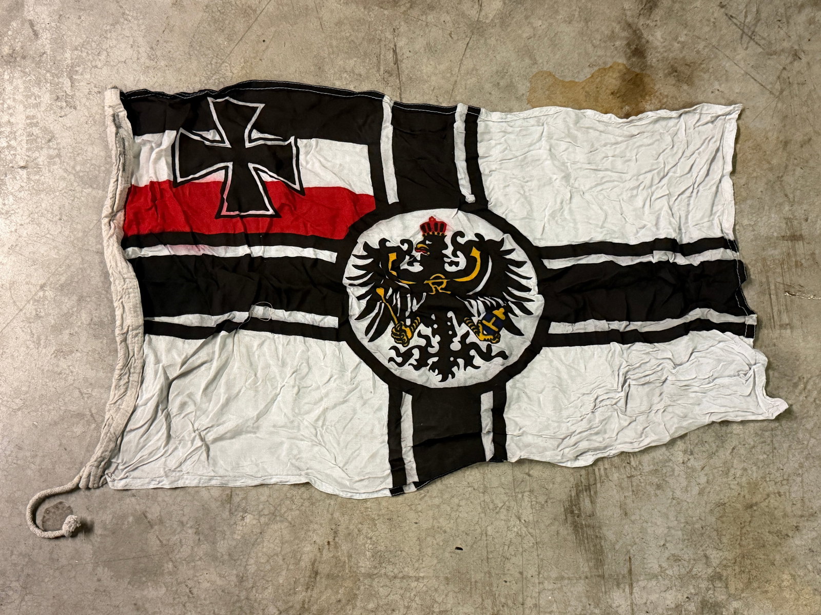 WW1 Imperial German Naval Ensign (Reichskriegsflagge), German Empire, c. 1903–1918: This textile flag is an example of the Imperial German Naval Ensign (Reichskriegsflagge), used by the German Empire during the reign of Kaiser Wilhelm II in the early 20th century. The design consists