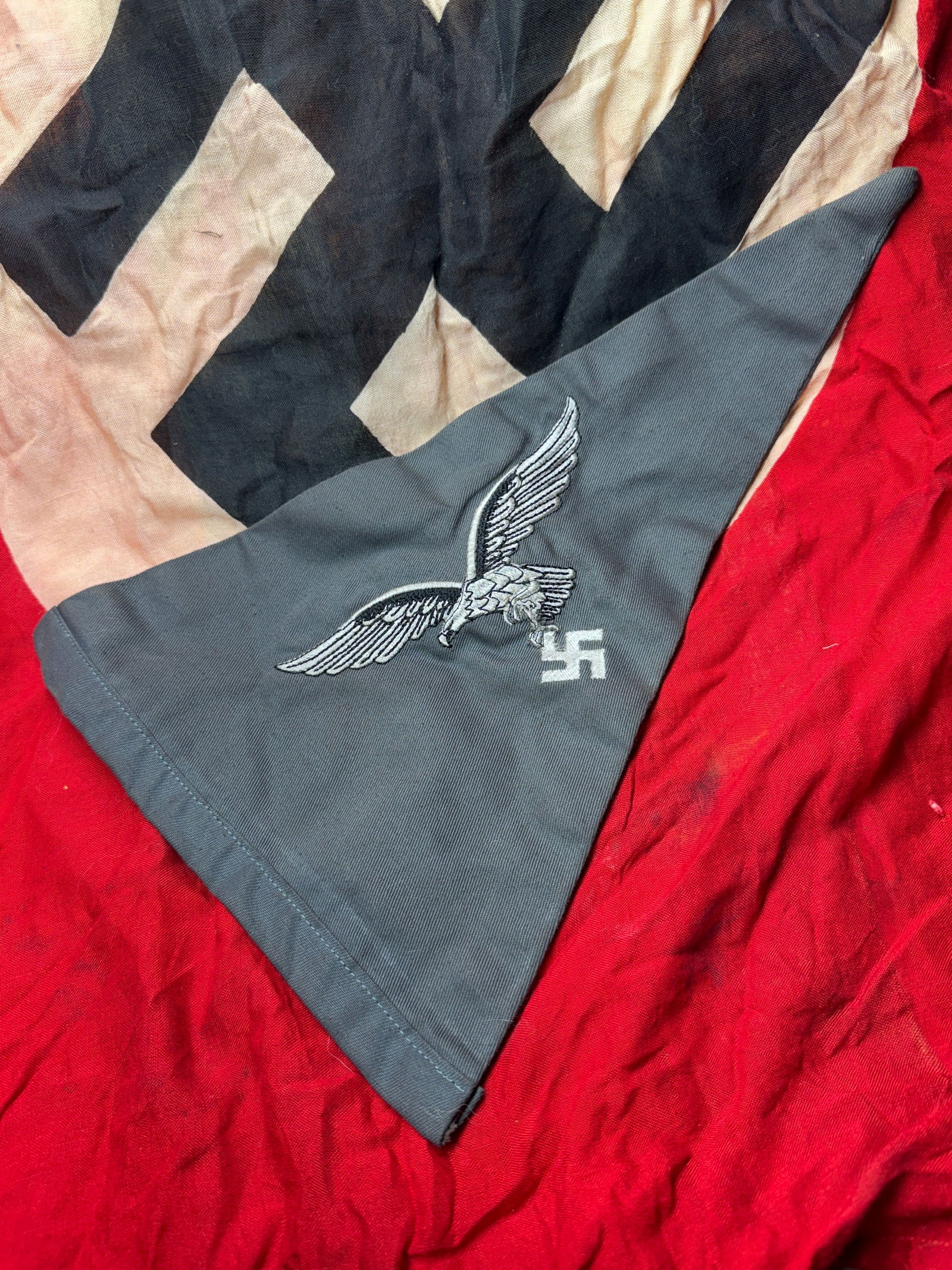 WW2 German Luftwaffe Unit Pennant, Nazi Germany, c. 1935–1945: This triangular pennant is identified as a World War II–era German Luftwaffe unit pennant. It features the Luftwaffe eagle—depicted in flight with wings outstretched—grasping a swastika, the sta