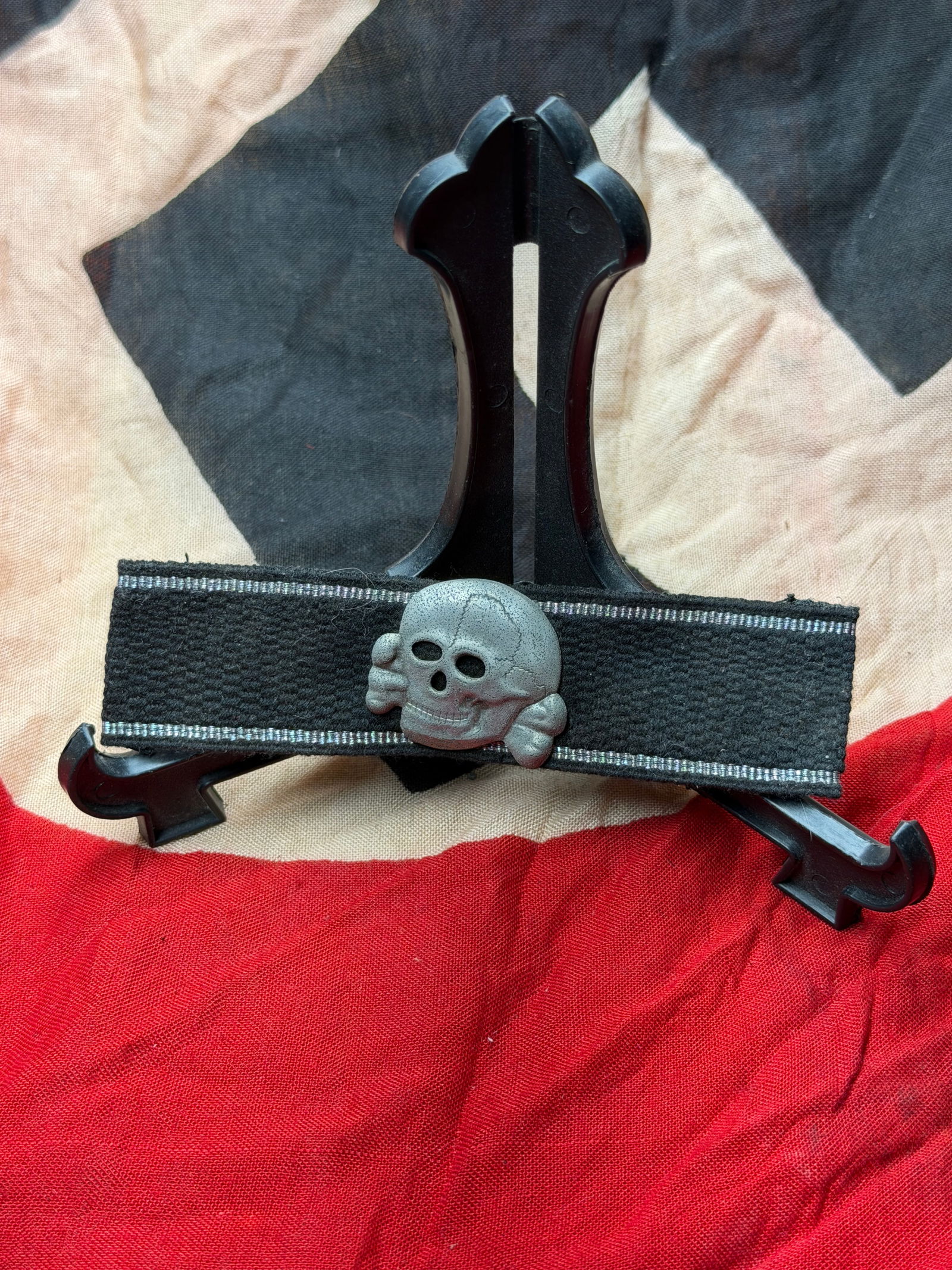 WW2 German SS Totenkopf Death Skull Cuff Title Badge With RZM Paper Tag, Nazi Germany, c.: This black cloth armband bears the Totenkopf (“death’s head”) emblem— a skull with crossed bones—one of the most recognizable and ideologically charged symbols used by the Schutzstaffel