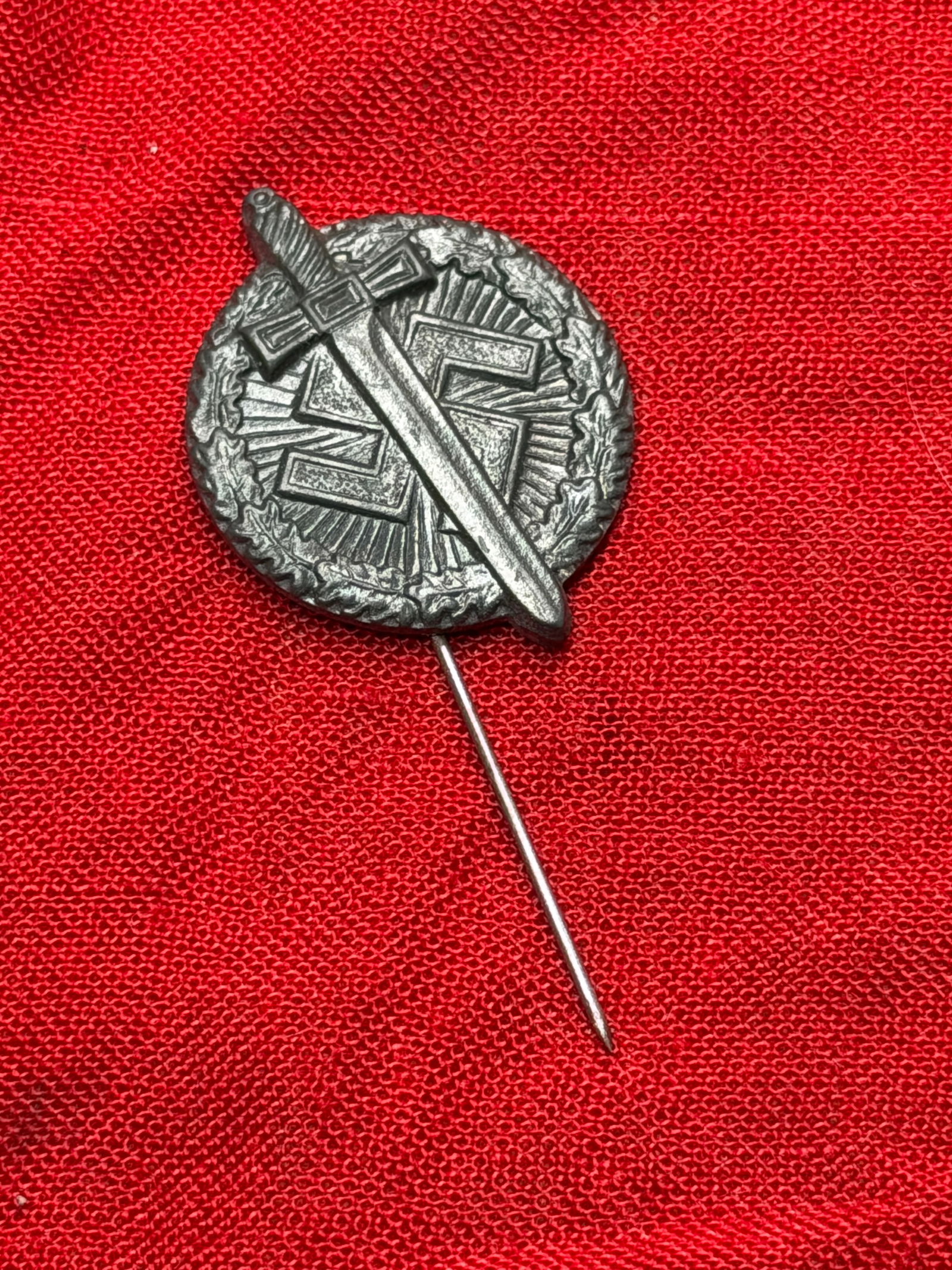 WW2 German SA Sports Badge Stickpin (SA-Sportabzeichen), Bronze Grade, Nazi Germany, c. 1933–1939: This small metal stickpin represents the SA-Sportabzeichen (SA Sports Badge), an award instituted in 1933 by the Sturmabteilung (SA), the Nazi Party’s paramilitary organization. The badge features a