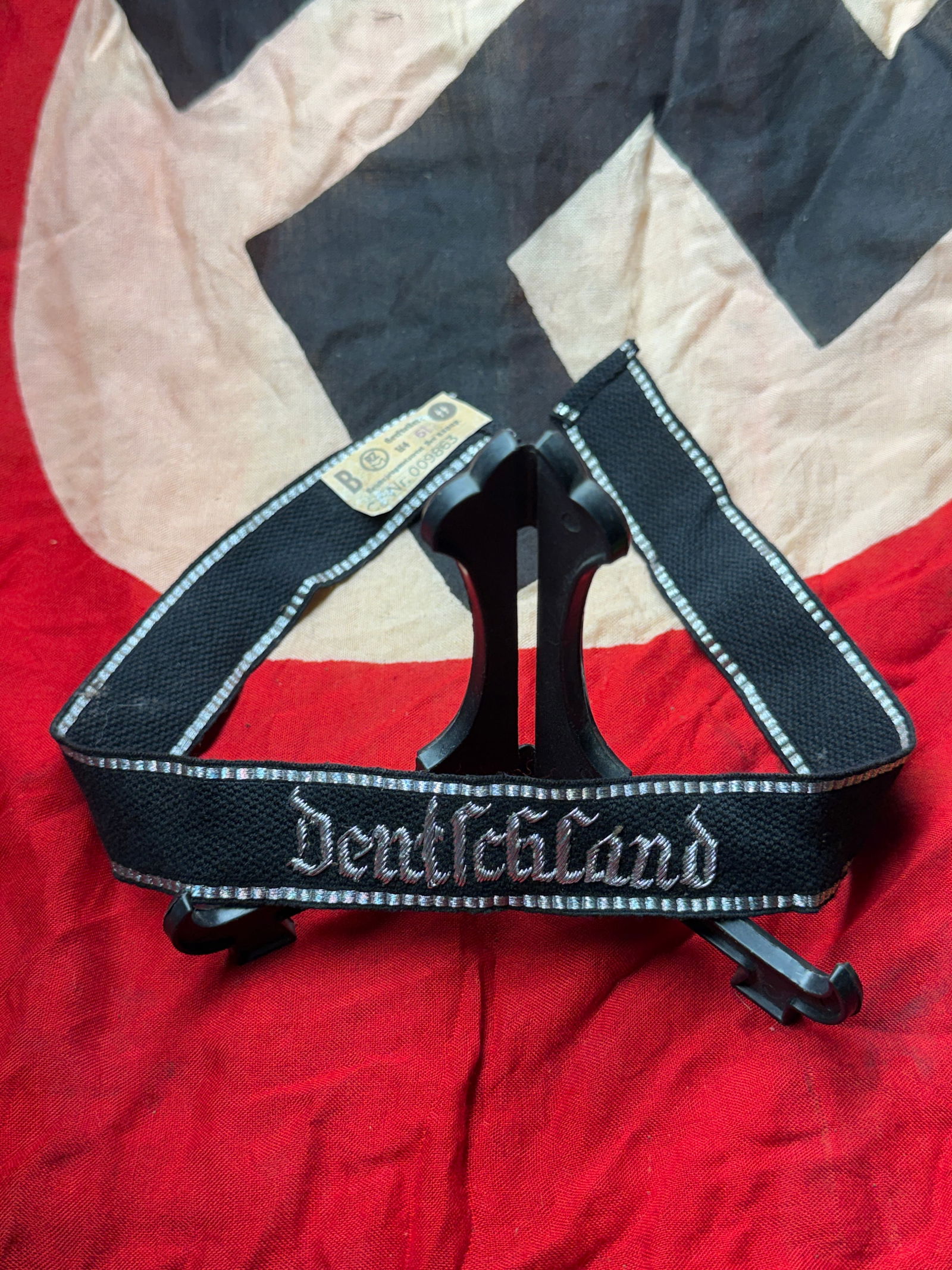 WW2 German SS Cuff Title “Deutschland?? (Ärmelstreifen) with RZM Tag, Nazi Germany, c.: This woven cuff title (Ärmelstreifen) bears the inscription “Deutschland”, identifying the wearer as a member of the SS-Verfügungstruppe / Waffen-SS regiment “Deutschland,” one of th