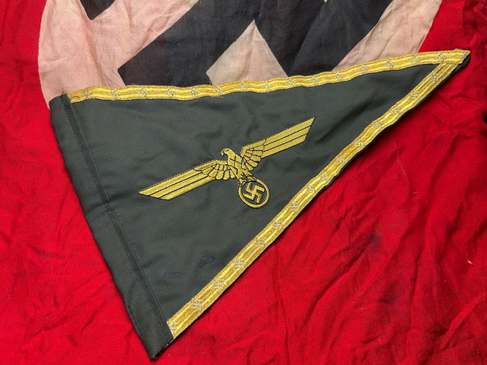WW2 German Wehrmacht Army Vehicle Pennant (Heer Fahrzeugwimpel), Nazi Germany, c. 1939–1945: This triangular cloth pennant was used by the German Army (Heer) as a vehicle identification and command marker during the Second World War. Constructed from field-gray fabric and bordered with gold w