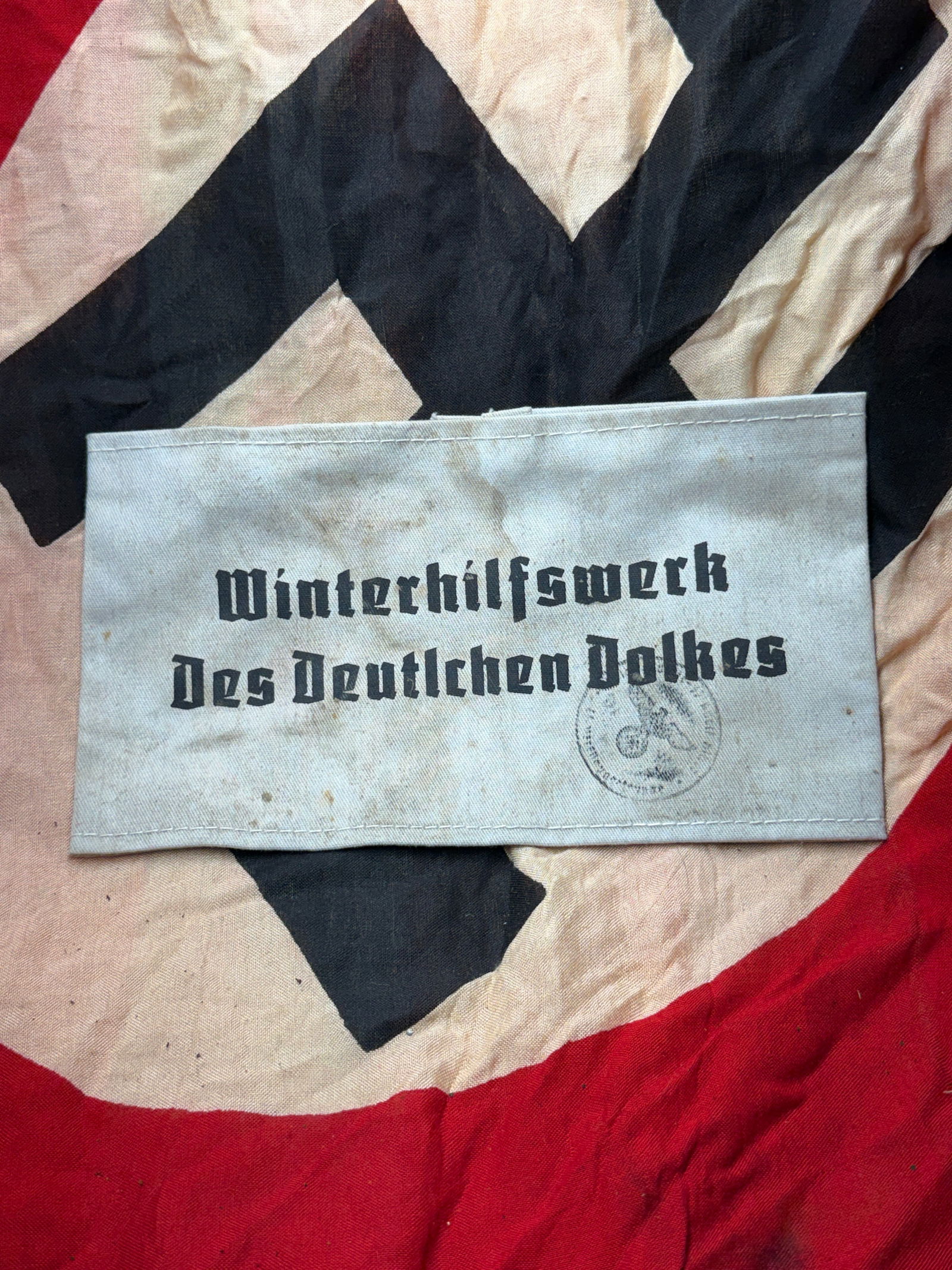 WW2 German Winterhilfswerk Armband (Winter Relief Organization of the German People): This textile armband is associated with the Winterhilfswerk des Deutschen Volkes (WHW), the Winter Relief Organization operated in Nazi Germany from 1933 to 1945. The WHW was presented as a nationwide