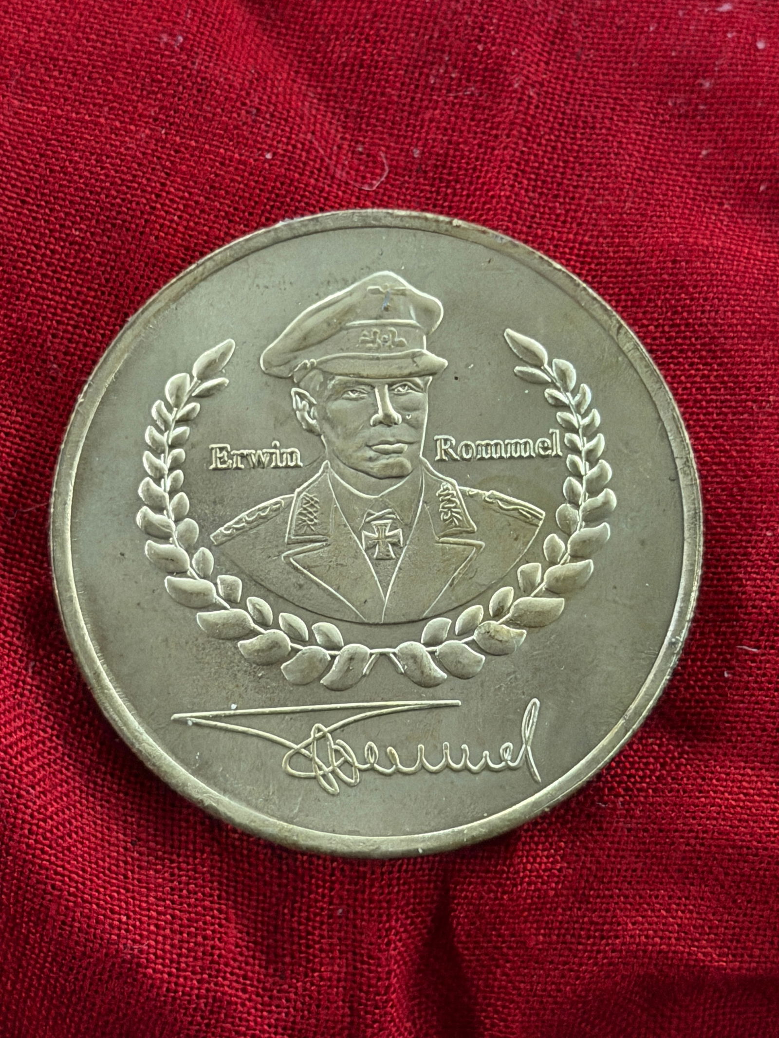 WW2 German Commemorative Medal of Field Marshal Erwin Rommel: This round commemorative medal bears a raised portrait of Erwin Rommel (1891–1944), one of the most prominent German military commanders of the Second World War, encircled by a laurel wreath symboli