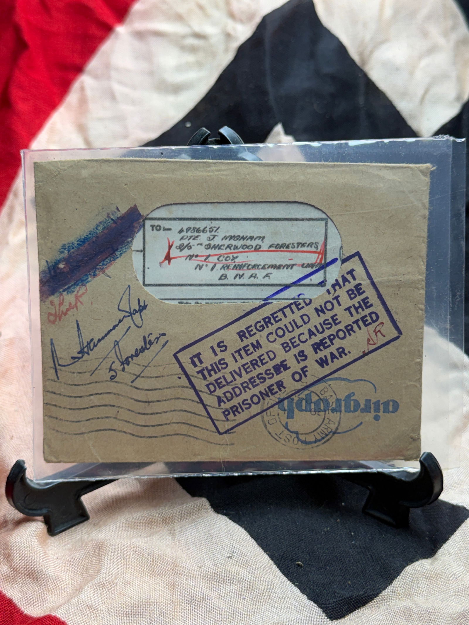 WW2 Returned Prisoner-of-War Mail Envelope, British Army Postal Service: This paper envelope represents a piece of returned wartime correspondence from the Second World War, associated with the British Army Postal Service. The envelope bears multiple official postal markin