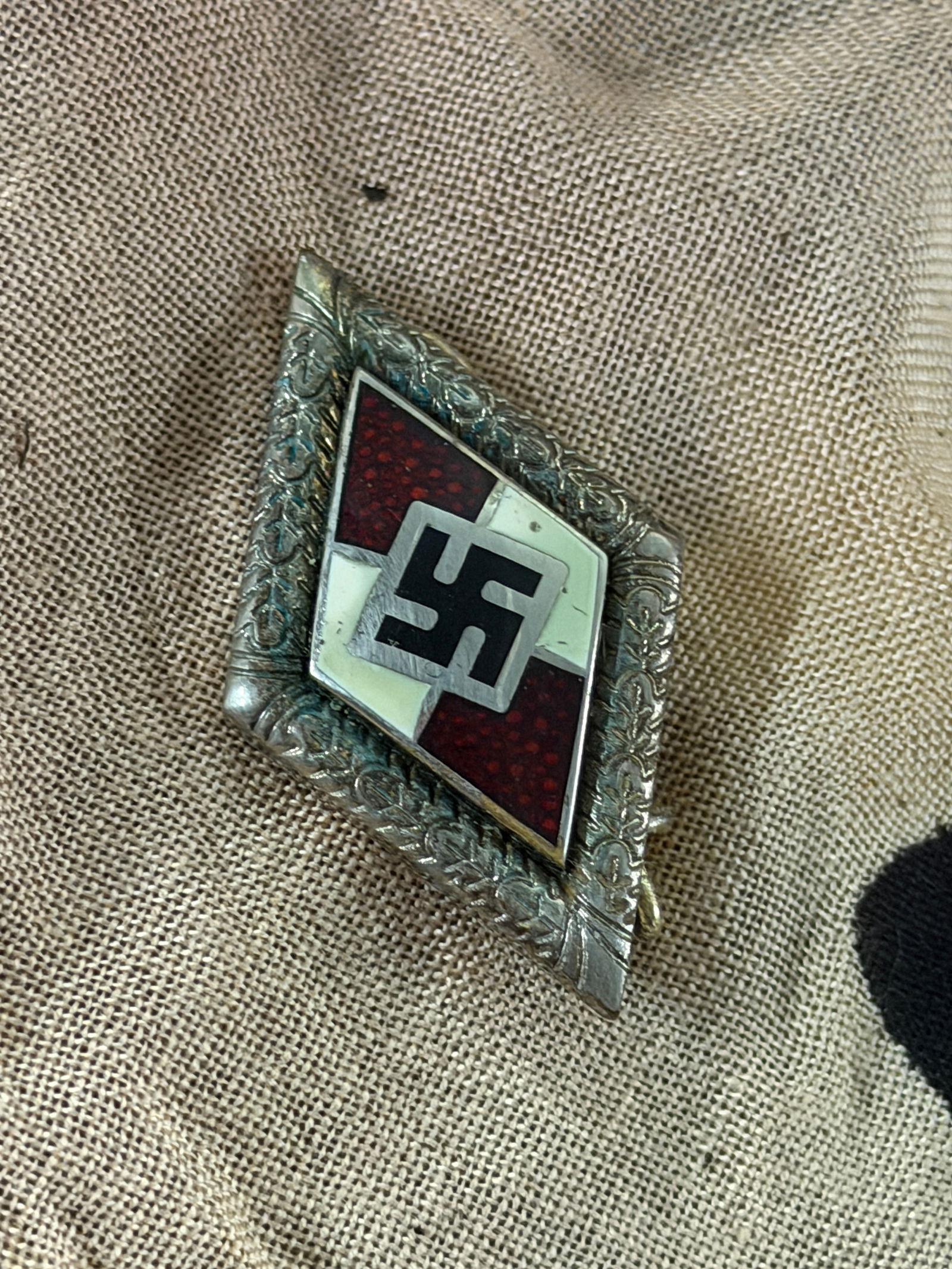 WW2 German Hitler Youth Membership Badge (HJ Abzeichen): This diamond-shaped enamel badge is a standard Hitler Youth (Hitlerjugend) membership insignia, worn by enrolled members of the Nazi Party’s youth organization in Germany during the Third Reich. The