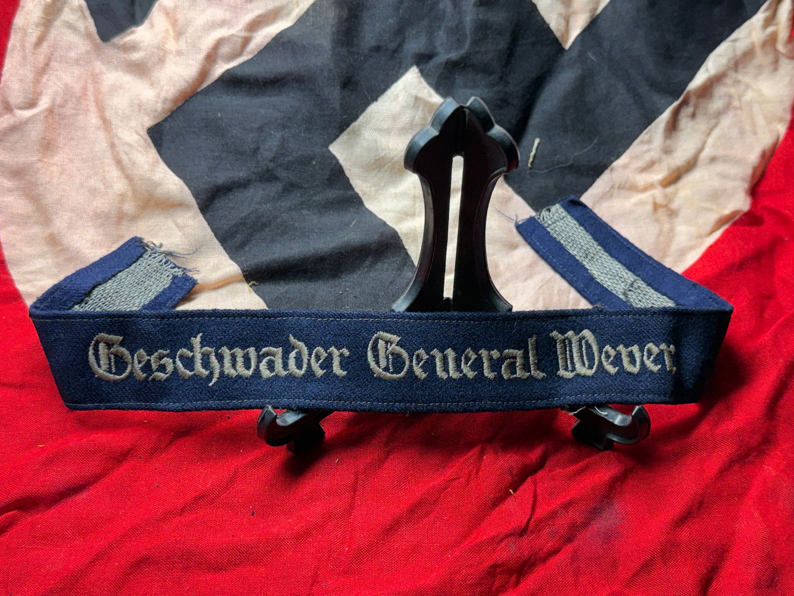 WW2 German Luftwaffe Cuff Title “Geschwader General Wever: This embroidered cloth cuff title bears the inscription “Geschwader General Wever,” identifying an aviation unit of the German Luftwaffe named in honor of General Walther Wever, the first Chie