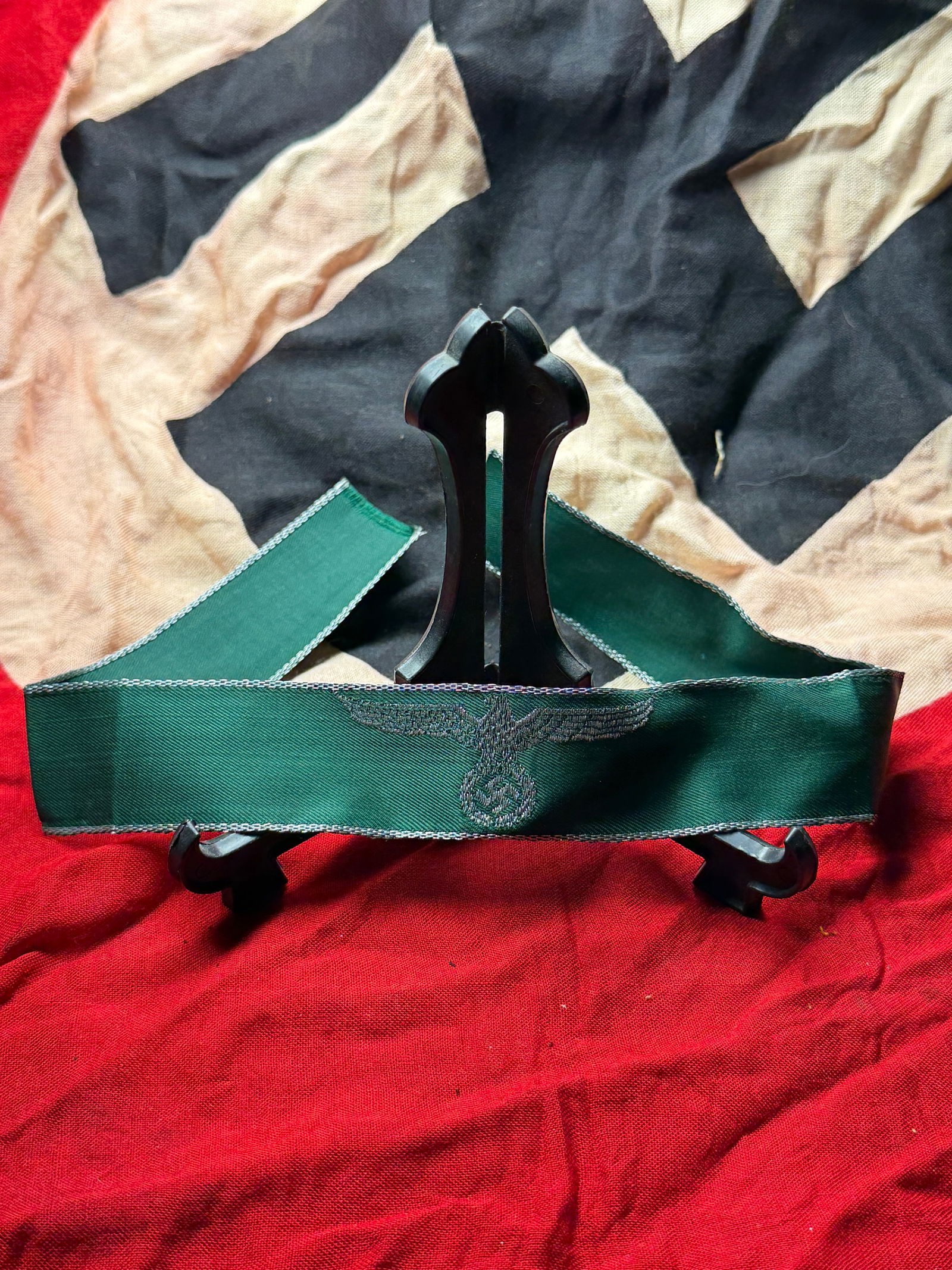 WW2 German Waffen-SS Green Cuff Title – BeVo Woven Sleeve Band: World War II–era German Waffen-SS green cuff title (Ärmelstreifen). Constructed from green woven fabric with BeVo-style machine weaving, featuring the embroidered eagle and emblem motif consistent