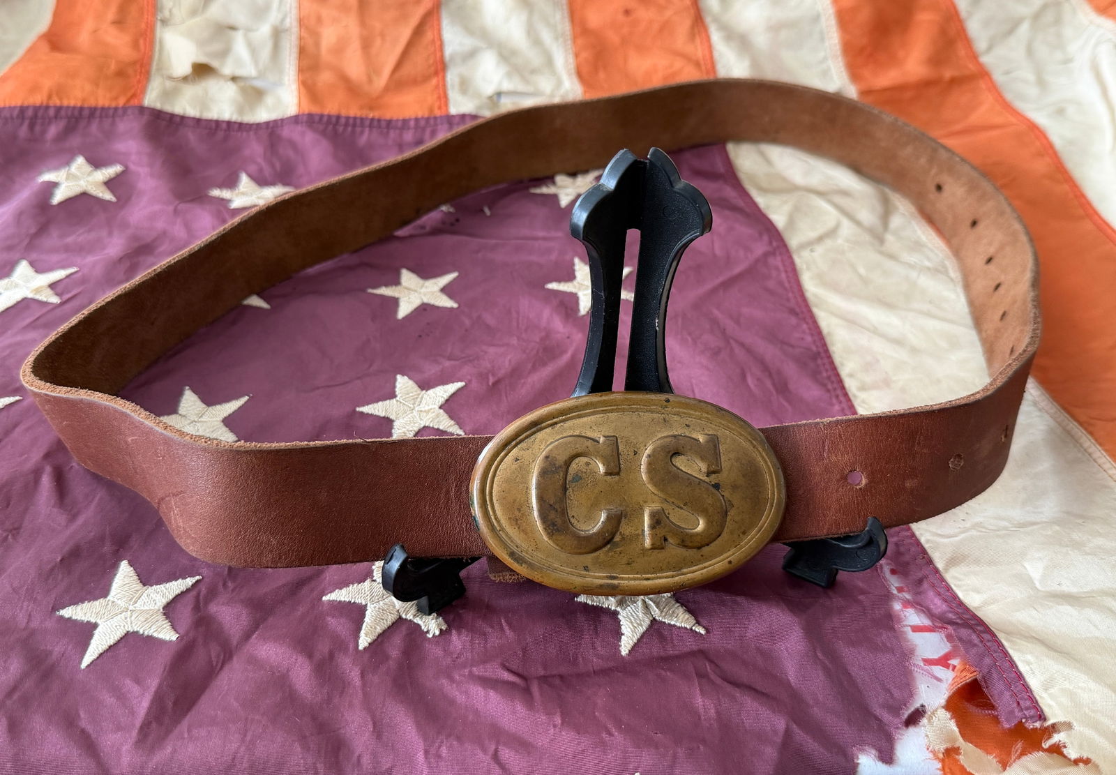 Confederate States Army Enlisted Waist Belt with “CS?? Oval Buckle, American Civil War, c.: This leather waist belt and oval brass buckle were worn by an enlisted soldier of the Confederate States Army during the American Civil War. The buckle bears the raised letters “CS” within a p