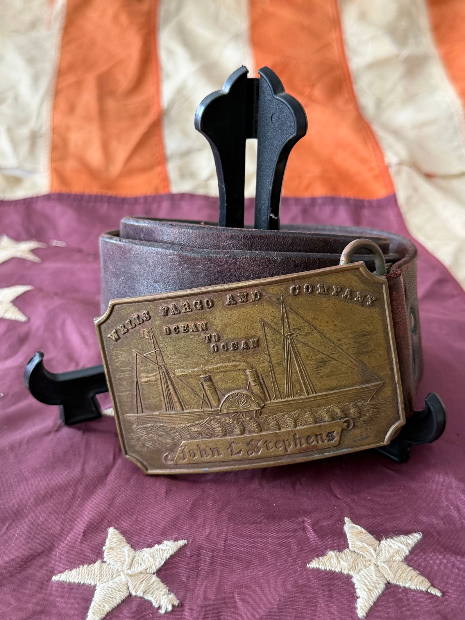United States Navy Presentation Belt Buckle with Steamship John L. Stephens, “West Fargo and: This large brass presentation belt buckle commemorates the American steamship John L. Stephens, a vessel central to mid-19th-century transoceanic travel and commerce. The obverse is richly engraved wi