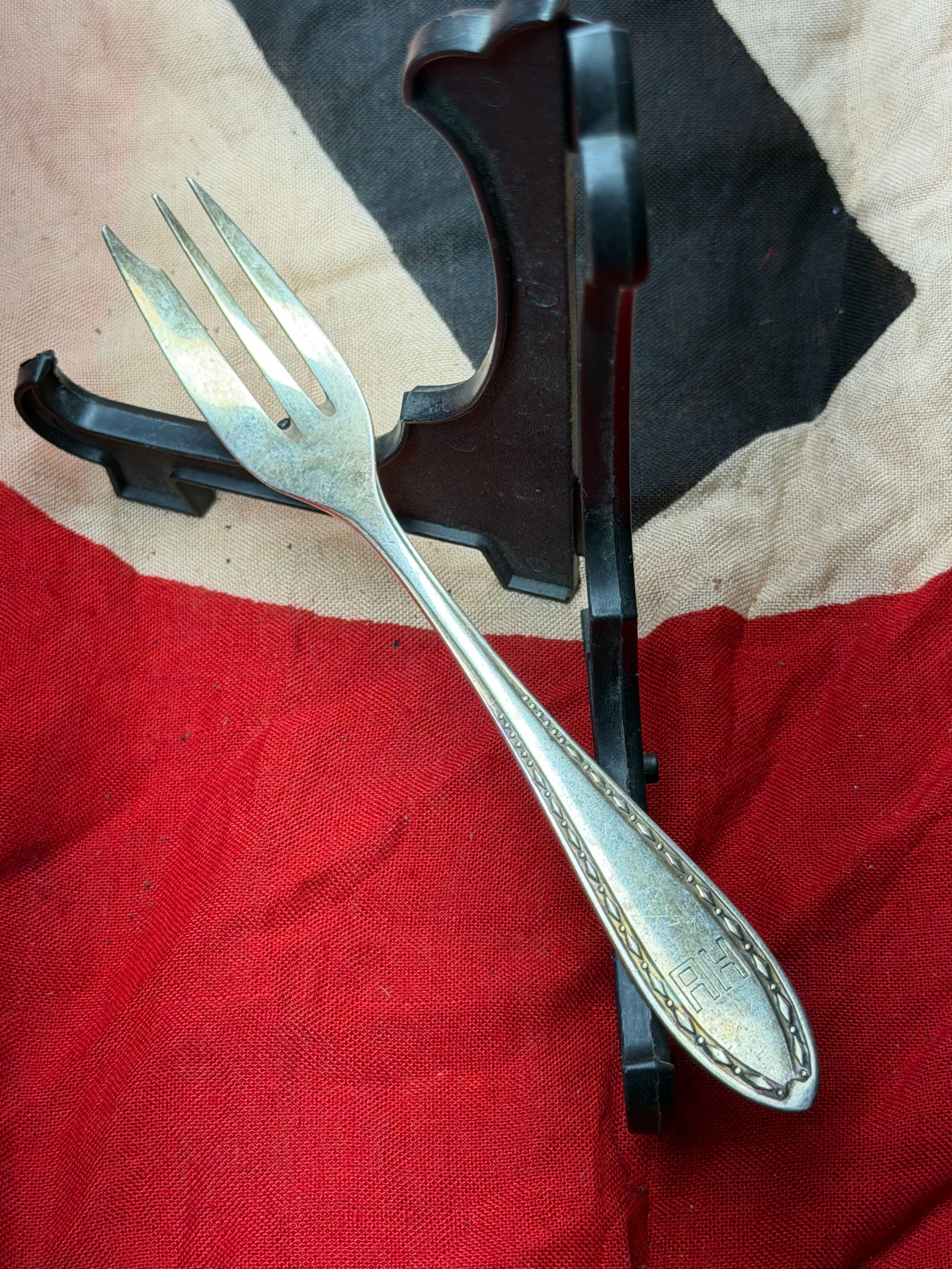 WW2 German Personal Silver Fork Attributed to Adolf Hitler, Germany, c. 1930s–1940s: This small silver fork is attributed to Adolf Hitler and is marked on the handle with the engraved initials “AH,” identifying it as part of his personal tableware. The fork bears German maker�