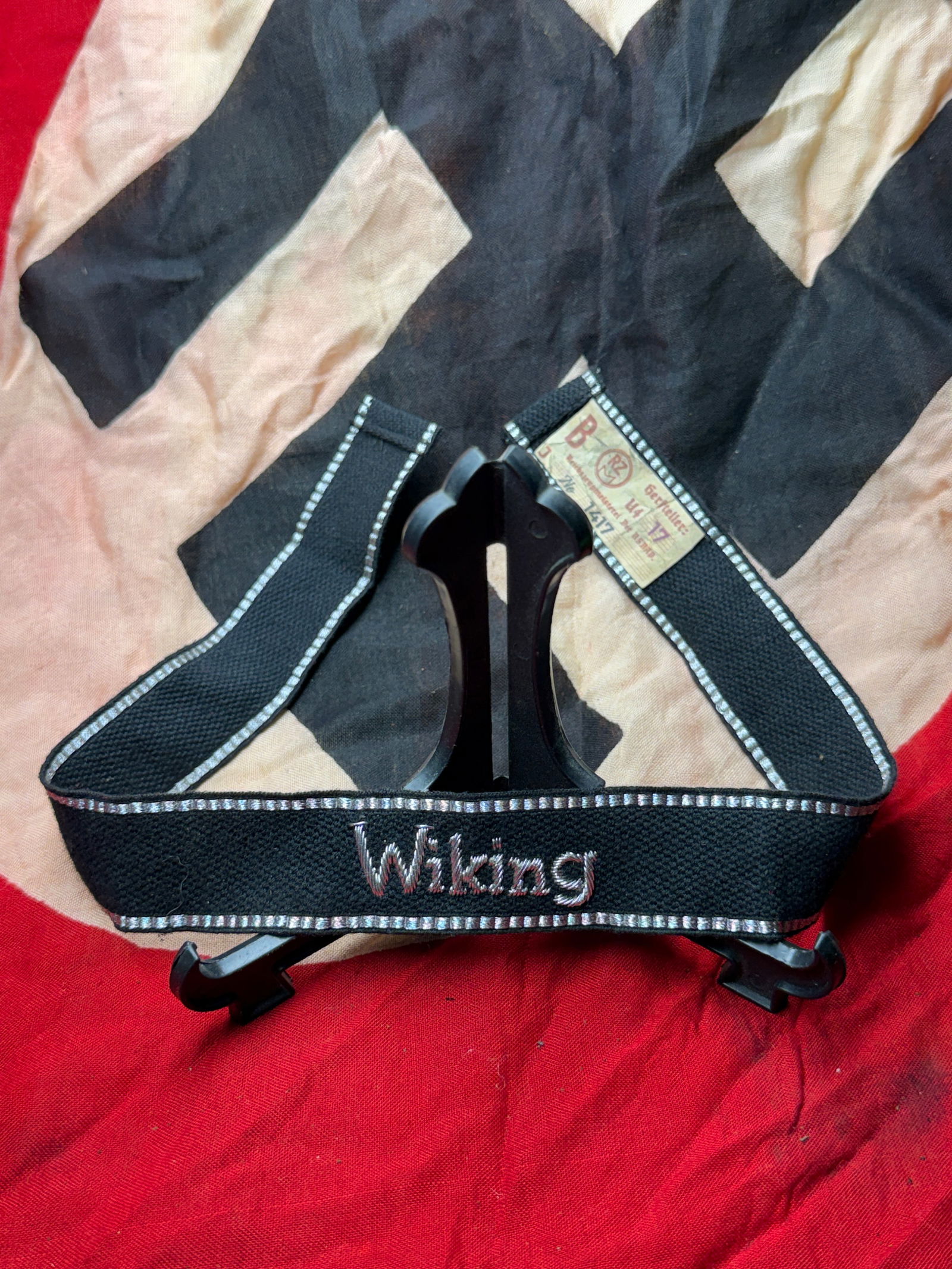 WW2 German Waffen-SS Cuff Title: “Wiking?? Division With RZM Paper Tag: This embroidered cuff title was worn on the lower sleeve of the uniform by members of the Waffen-SS Division Wiking, a German-led multinational formation active on the Eastern Front during the Second