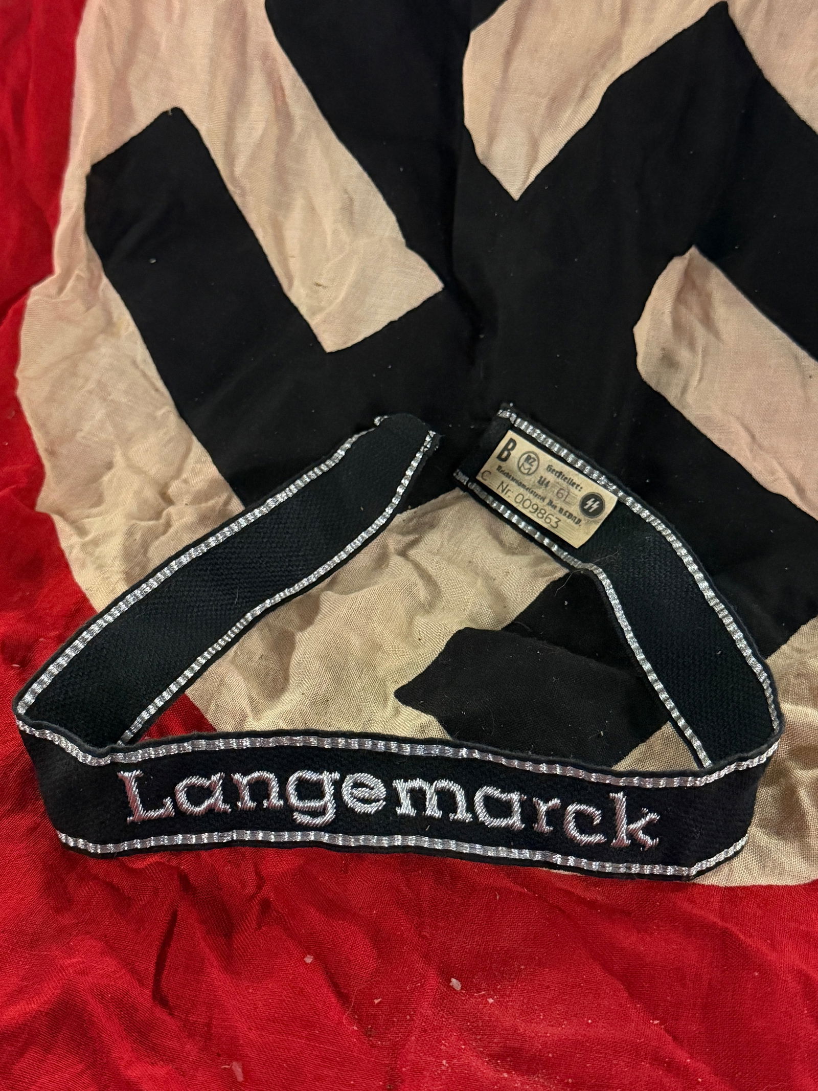 WW2 German Waffen-SS Cuff Title (Ärmelstreifen): Langencrack: This cuff title (Ärmelstreifen) was worn on the lower left sleeve of uniforms by personnel of the Waffen-SS assigned to SS-Ausbildungslager Langencrack, a Waffen-SS training and replacement camp loca