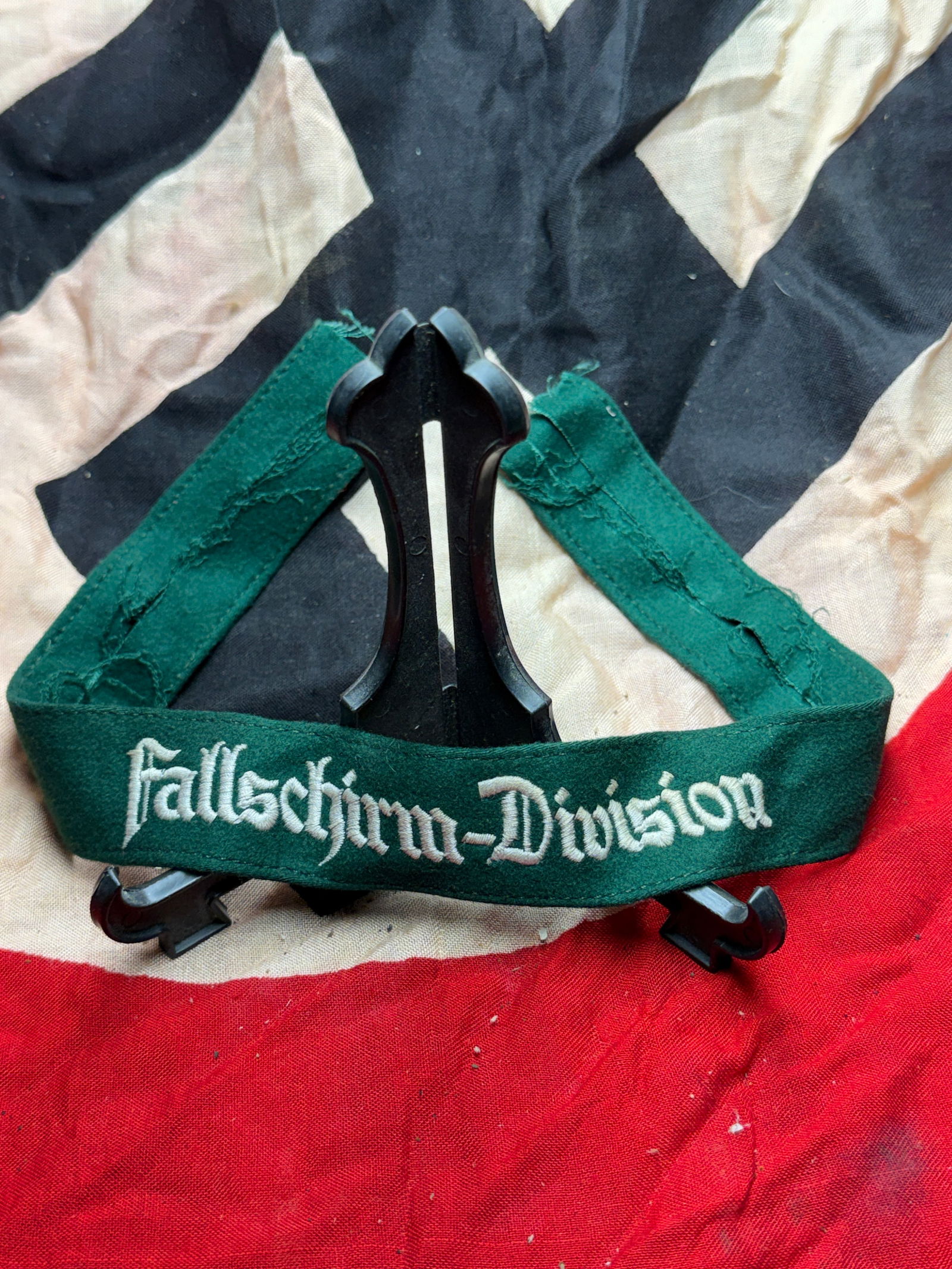WW2 German Cuff Title of the German Fallschirmjäger Division (Fallschirm-Division): This cuff title bears the inscription “Fallschirm-Division” and was worn on the lower sleeve of the uniform by members of Germany’s airborne forces (Fallschirmjäger) during the Second World