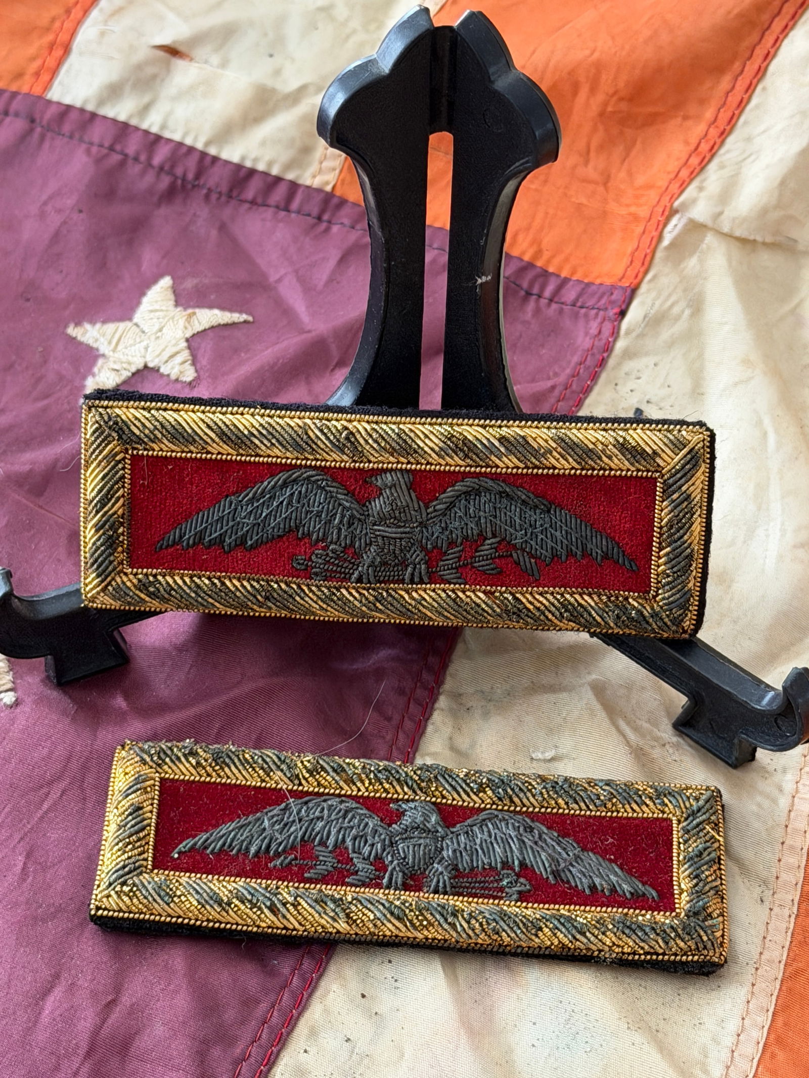 Union Army Infantry Colonel Shoulder Boards, Civil War Era: This matched pair of United States Army infantry colonel shoulder boards dates to the American Civil War (1861–1865). Constructed on a dark wool base, each board features the distinctive silver bull