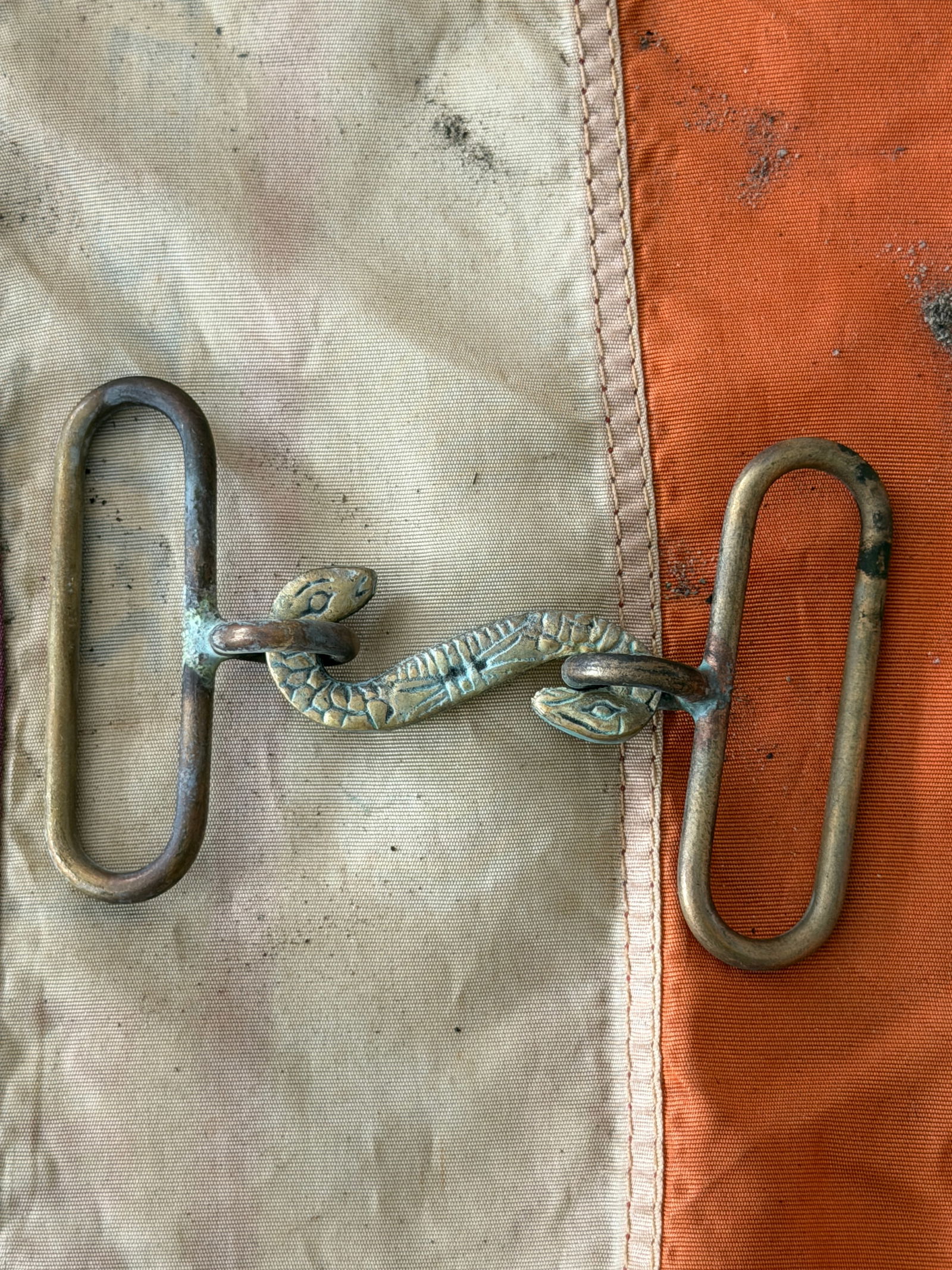 Civil War Confederate Two-Piece Snake Belt Plate (CSA): This rare two-piece belt plate dates to the American Civil War (1861–1865) and is attributed to the Confederate States of America. Cast in brass, the buckle consists of a stylized serpent forming th