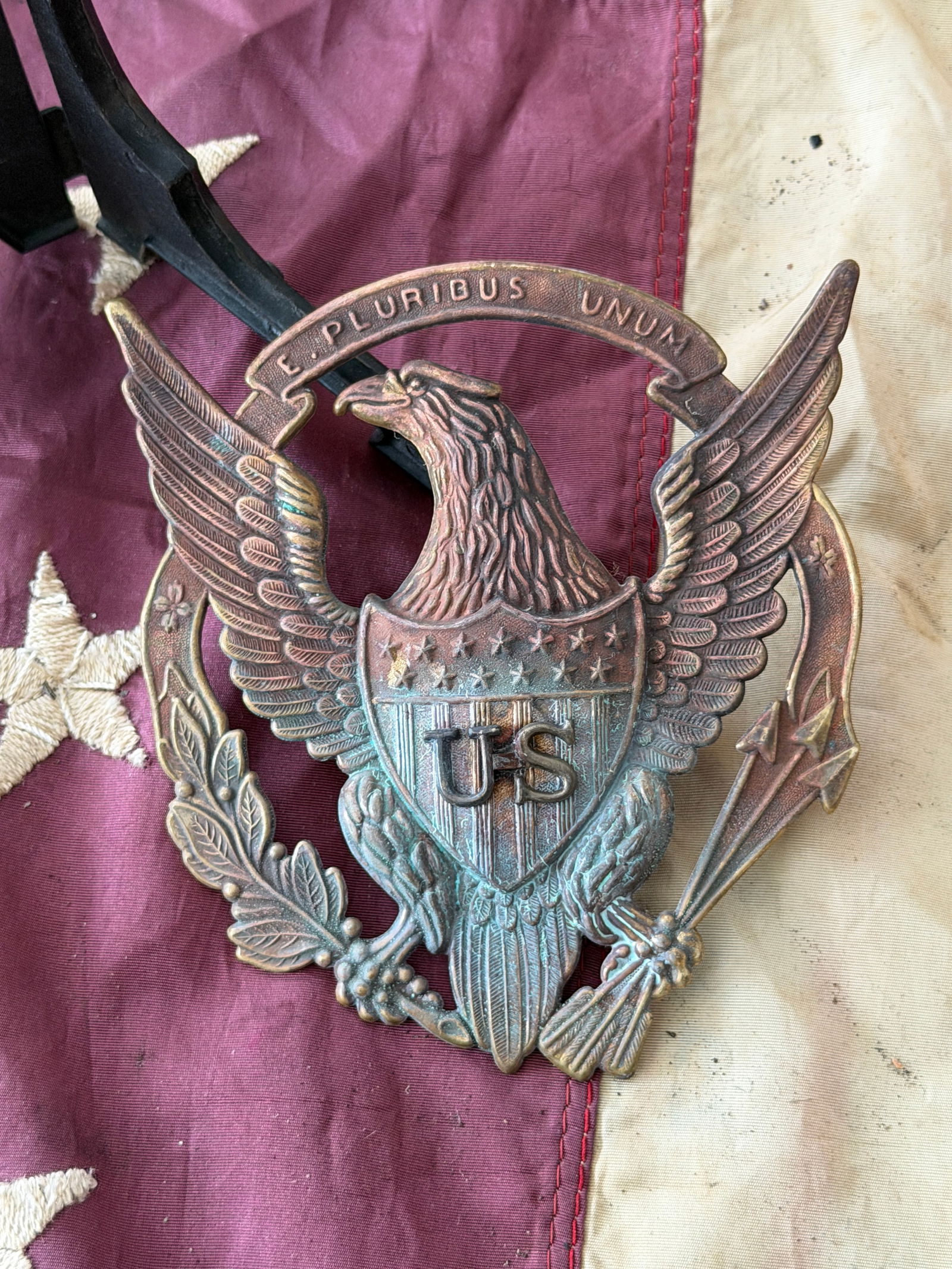 Rare Indian Wars Era U.S. Shako Helmet Eagle Badge – “E Pluribus Unum: Indian Wars–period U.S. Army Shako helmet badge, dating to the post–Civil War frontier era (circa 1870s–1880s). This striking insignia features the classic spread-wing American eagle with shield