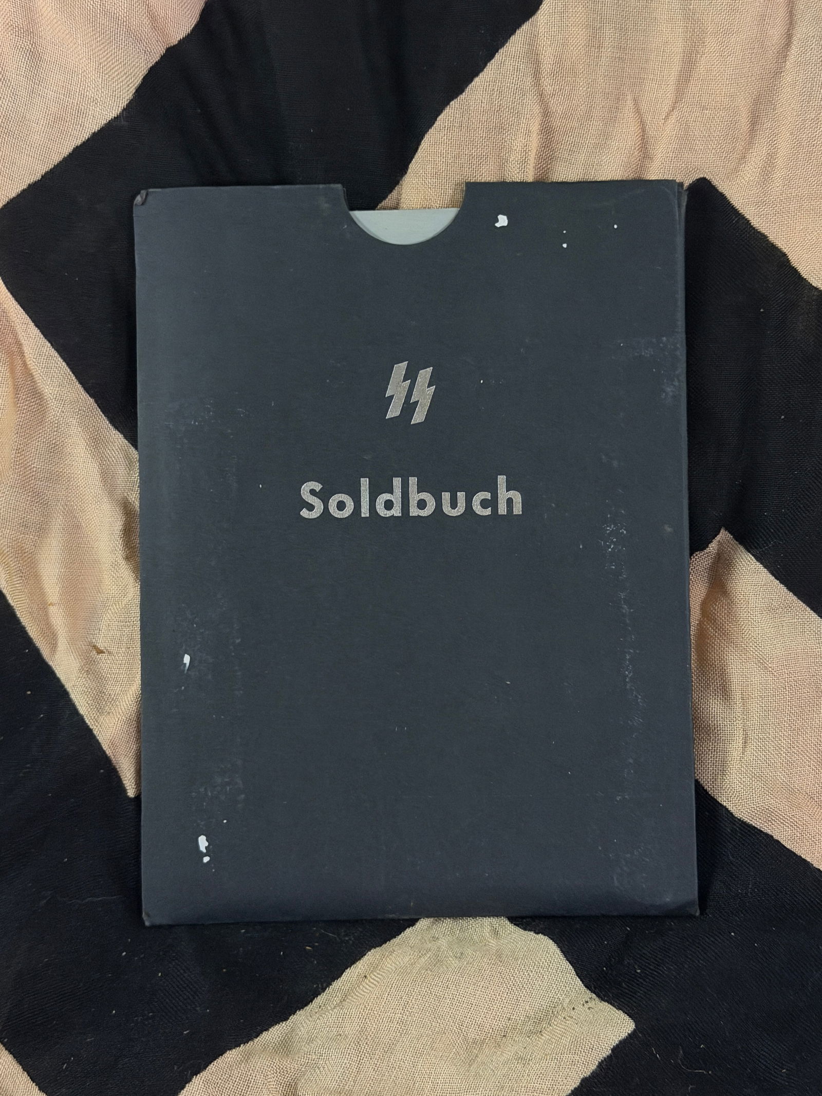 WW2 German SS Soldbuch and Auxiliary Identification Documents: This group consists of an SS Soldbuch (soldier’s pay and service book), an outer protective cover, and an Auxiliary Interpreter Identification Card (Hilfsdolmetscher) issued by the Waffen-SS during