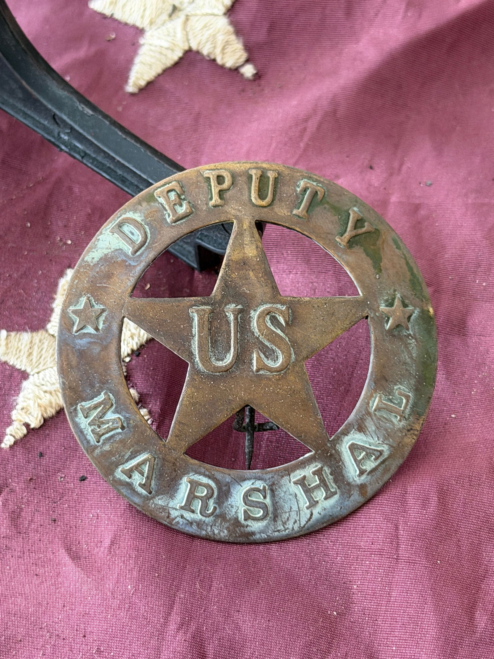Antique Deputy U.S. Marshal Star Badge: Deputy United States Marshal badge dates to the mid–19th century and reflects the authority of federal law enforcement during a formative period in American history. The badge features a five-pointe