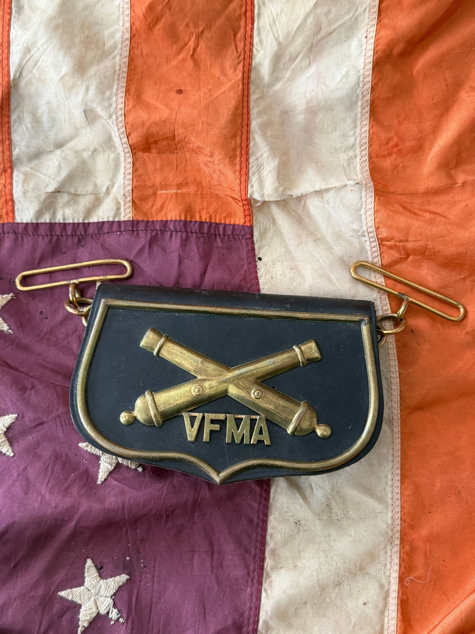 Civil War–Period Artillery Cartridge Box with VFMA Insignia: This leather artillery cartridge box dates to the American Civil War period (circa 1861–1865) and bears the brass insignia “VFMA” beneath crossed artillery cannons. The box is constructed of
