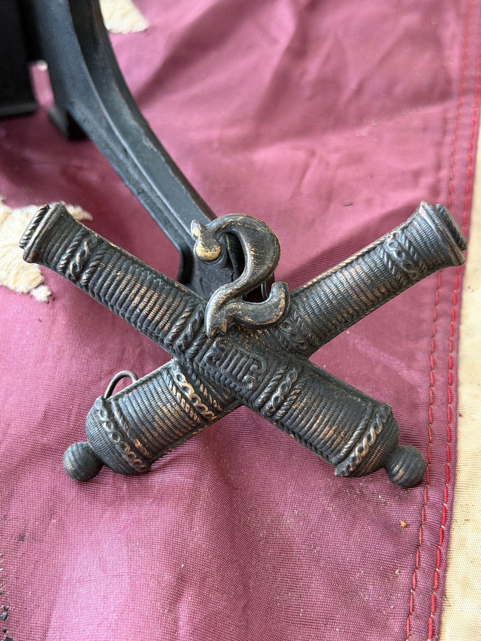 Civil War 2nd U.S. Artillery Crossed Cannons Badge (Civil War Period, False Embroidery): This Civil War–era crossed cannons badge represents the 2nd United States Artillery and is an example of a false embroidered insignia—a metal badge manufactured to imitate the appearance of embroi