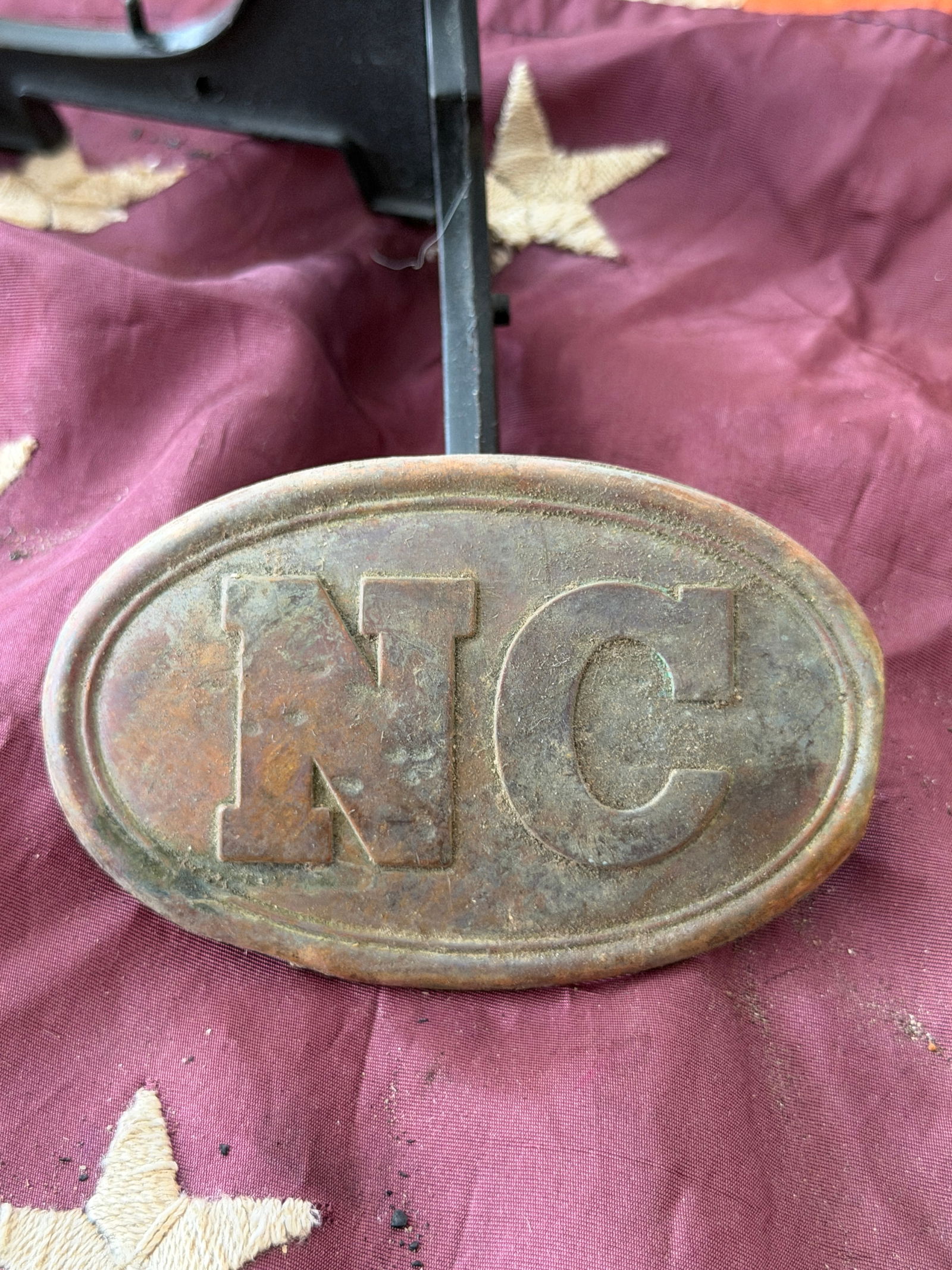 Civil War Confederate North Carolina “NC?? Belt Plate From Antietam, MD: This oval brass belt plate bears the raised letters “NC,” identifying it as a North Carolina state issue buckle from the American Civil War (1861–1865). Worn on the waist belt by North Carol