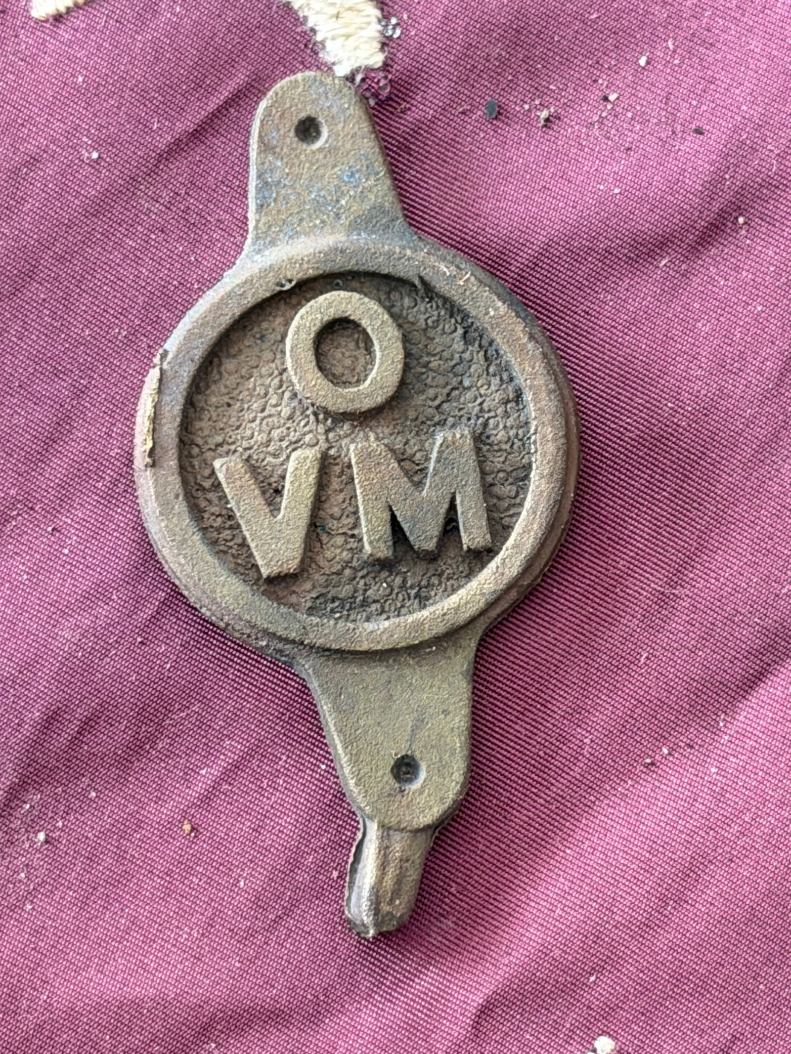 Civil War Ohio Volunteer Militia (OVM) Cap or Shoulder Device: This cast brass insignia bears the raised letters “OVM,” identifying it as an emblem of the Ohio Volunteer Militia, a state-organized force active primarily during the mid–19th century. Such