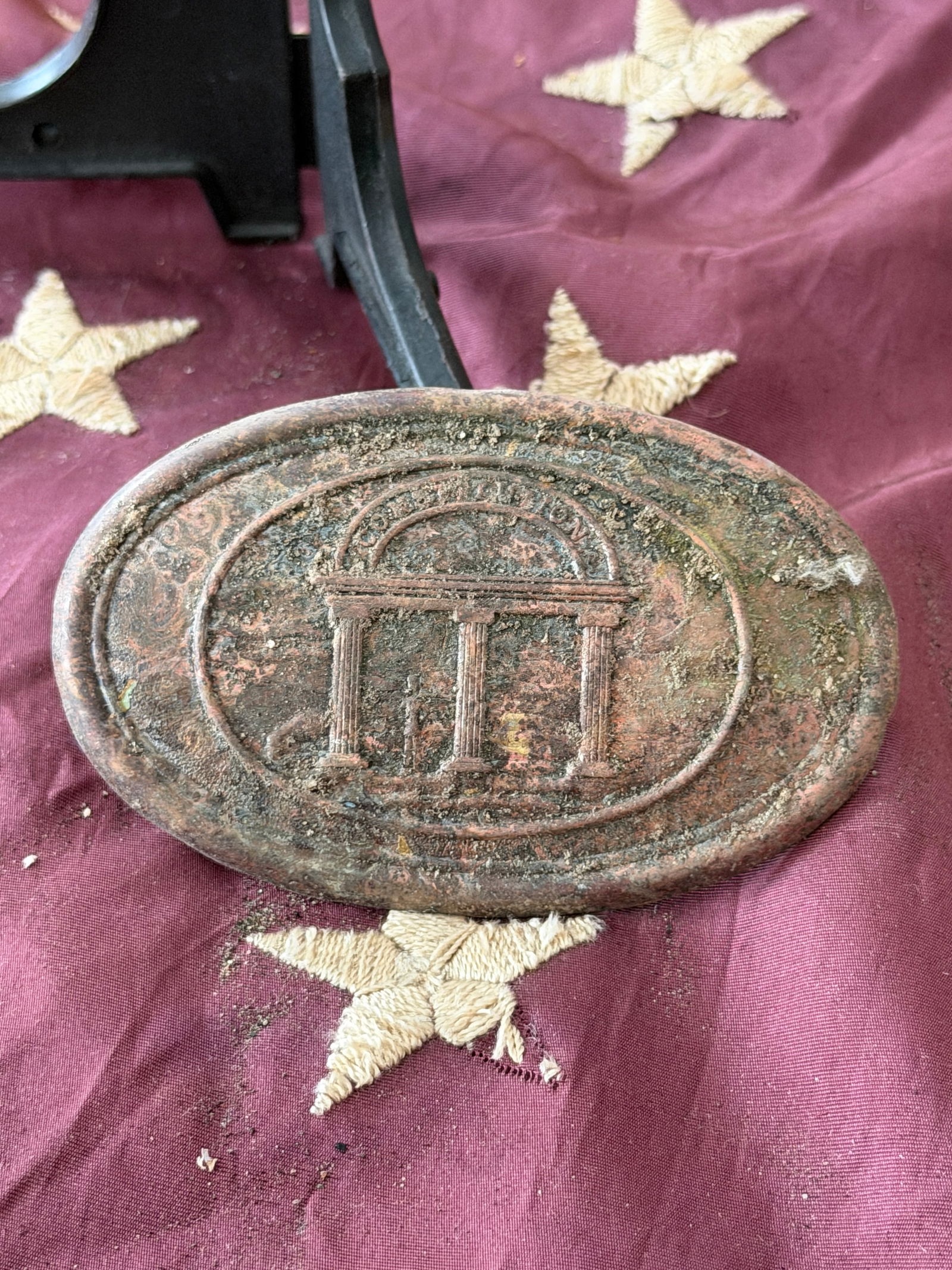 Civil War Confederate Georgia State Oval Belt Plate From Biloxi, Mississippi: This excavated oval belt plate is a Confederate States artifact associated with Georgia state forces, dating to the American Civil War (1861–1865). Cast in brass, the plate features the distinctive