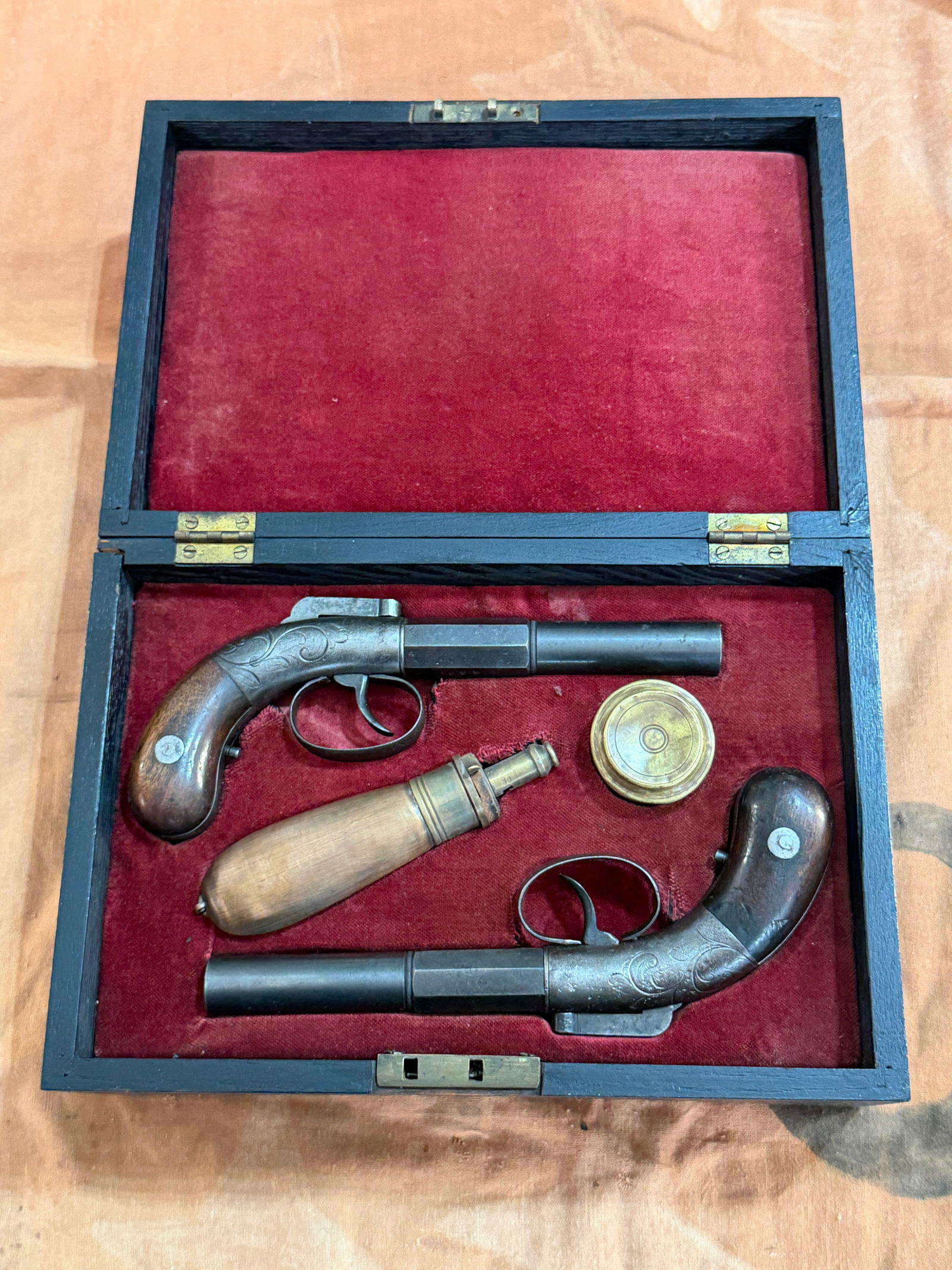 Cased Pair of Civil War–Era Percussion Pocket Pistols with Accessories: This exceptional Civil War–era cased pocket pistol set represents a rare and highly desirable survival from mid-19th-century America. These are dated 1837 and was used during the Civil War. Housed i