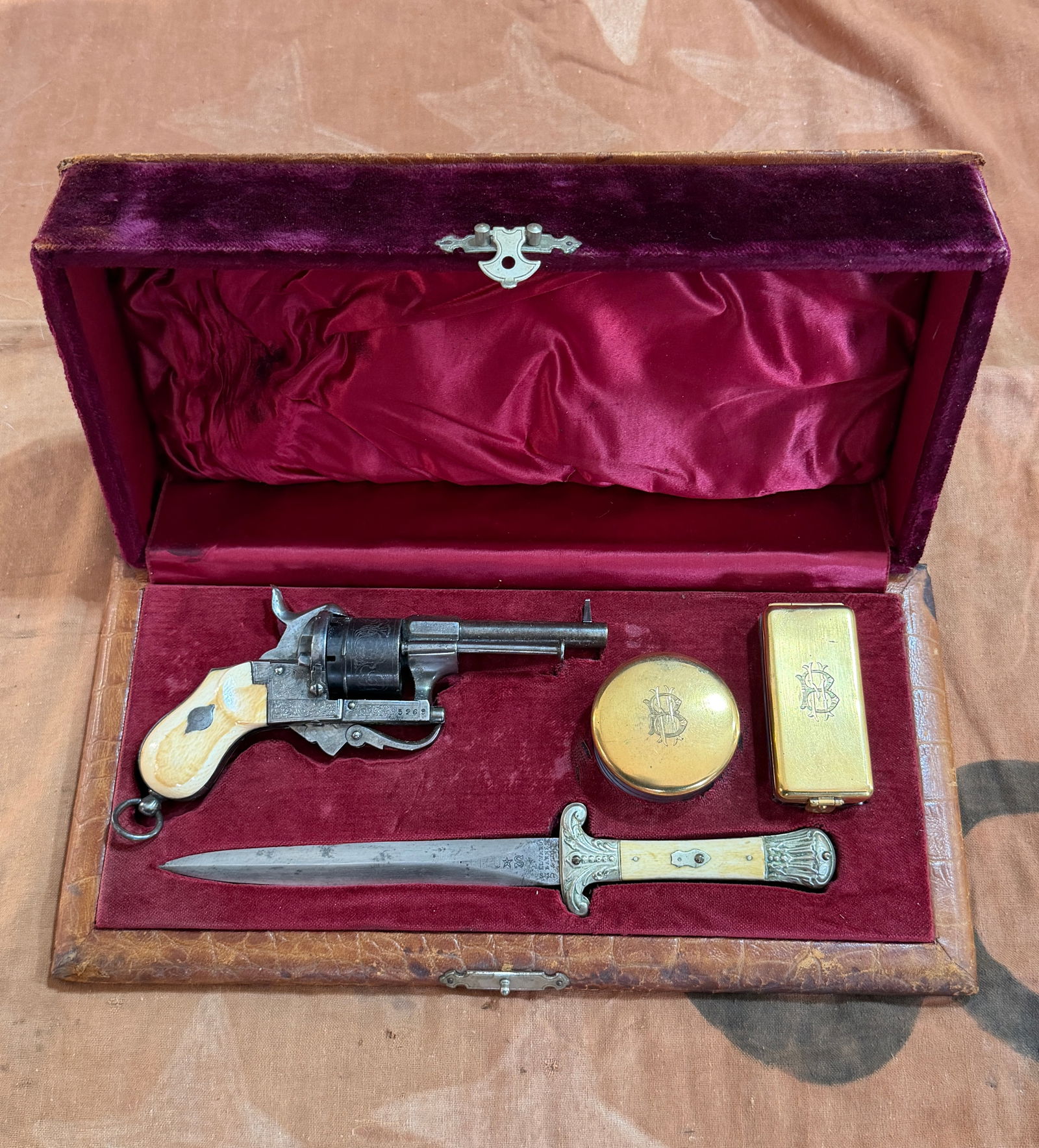 Civil War Engraved Percussion Revolver And Bone-Handled Dagger In Orig. Case: Offered here is an exceptional mid-19th century gentleman’s traveling arms ensemble, preserved in its original fitted presentation case—a complete and evocative survival from the era of refined pe
