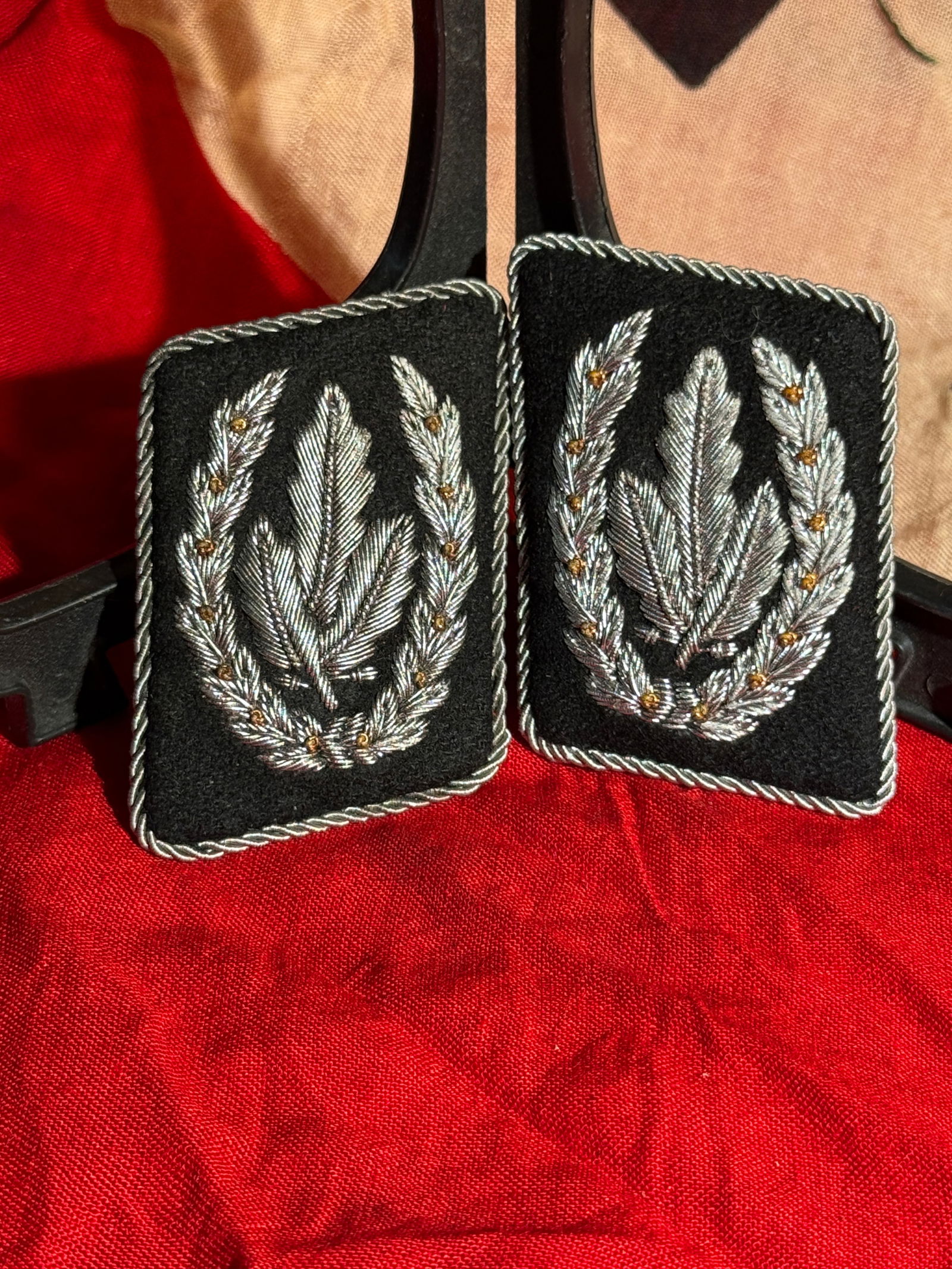 WW2 German SS Officer Collar Tabs with Oak Leaf Embroidery & RZM Paper Tag, Nazi Germany, c.: Pair of black cloth SS officer collar tabs featuring finely embroidered silver oak leaf designs with gold accent stitching, bordered by twisted silver piping. Oak leaf motifs were commonly used to den