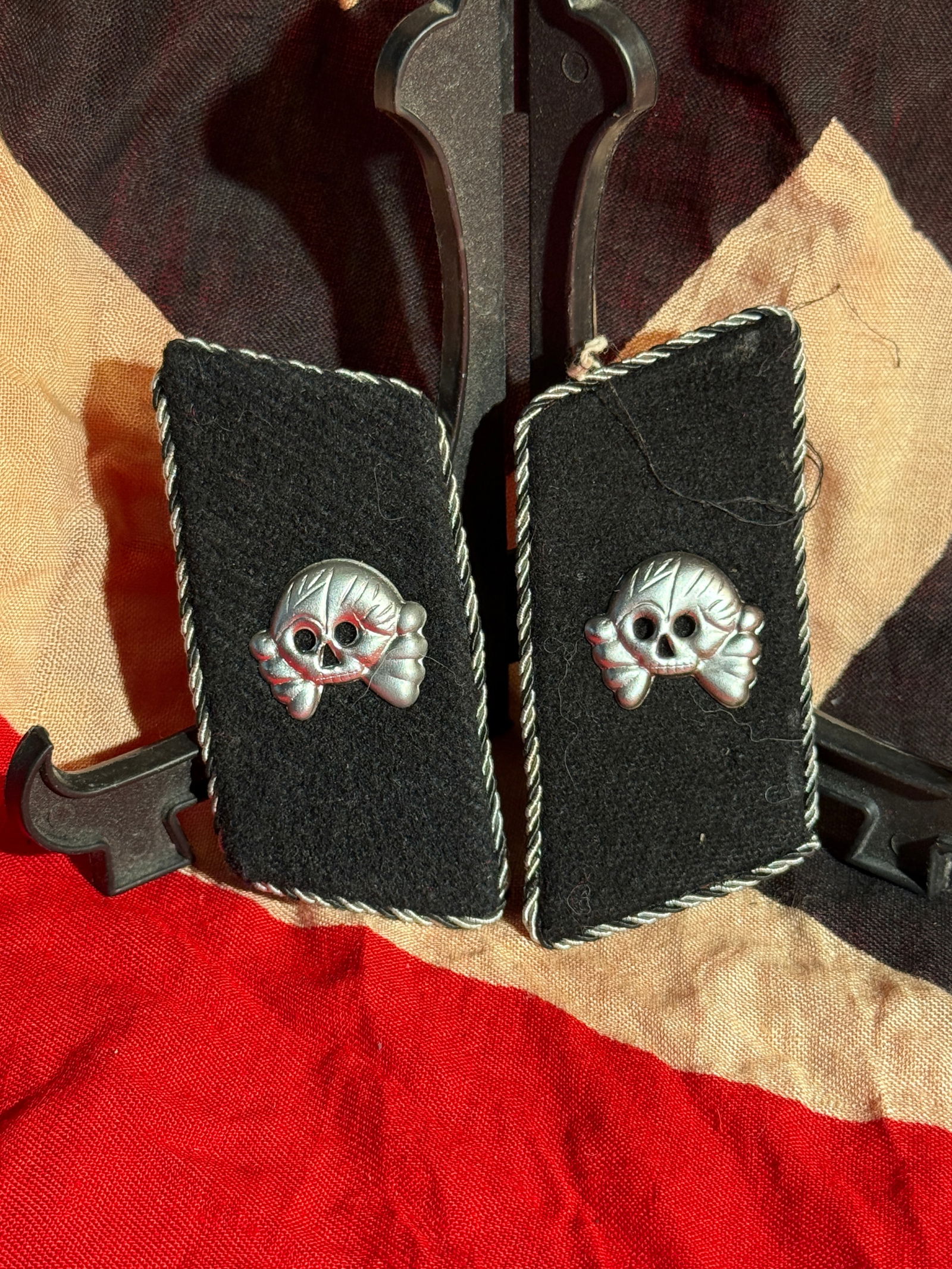 WW2 German Waffen-SS Panzer Collar Tabs (Totenkopf), Nazi Germany With RZM Paper Tag: Pair of black wool Waffen-SS Panzer collar tabs featuring the Totenkopf (skull and crossbones) insignia in silver-colored metal. The skull emblem was traditionally associated with German armored and S