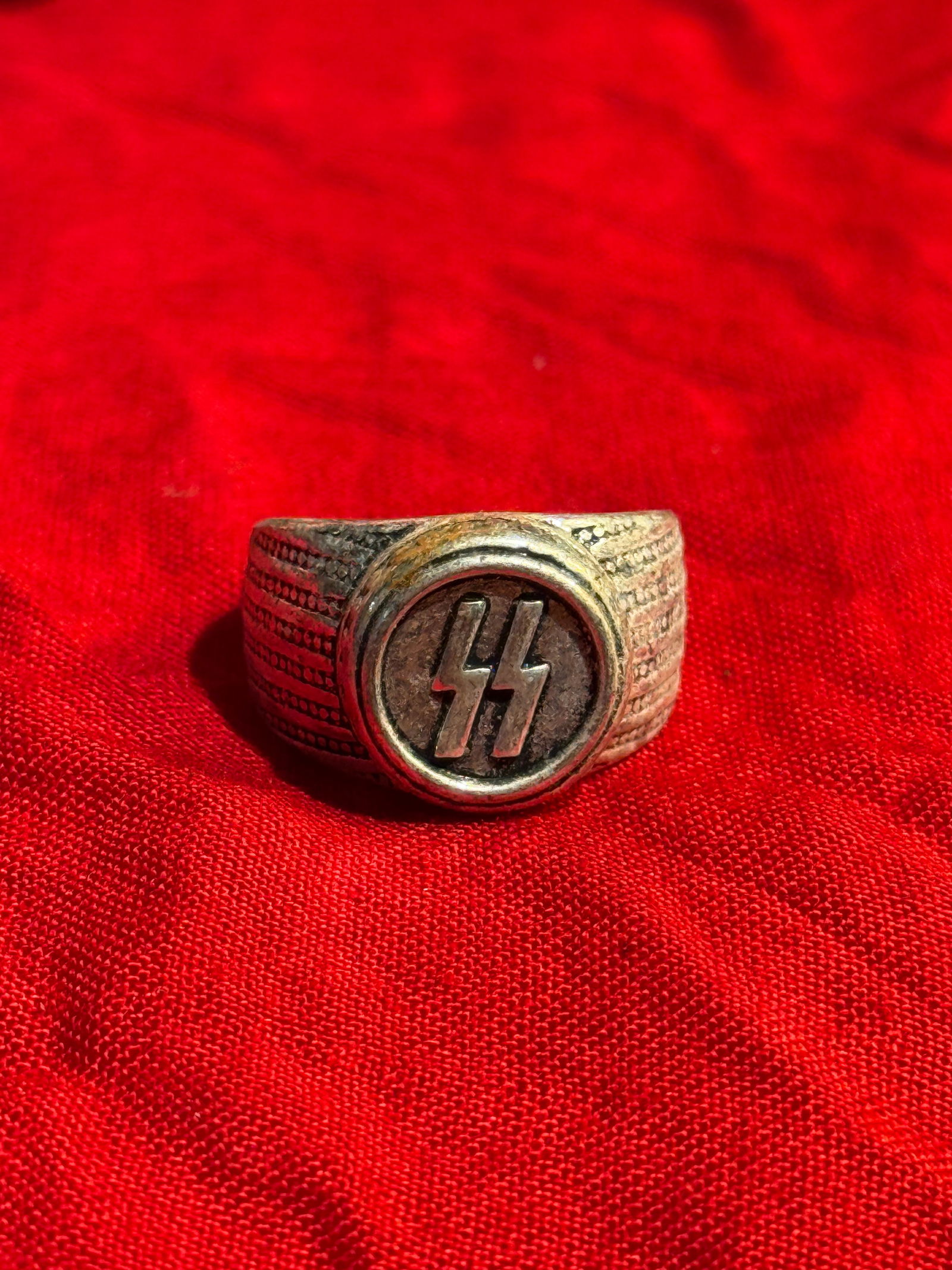 WW2 German Waffen-SS Enlisted Man’s Signet Ring with SS Runes: This Waffen-SS signet-style ring features the distinctive double Sig-rune emblem, the symbol used by the Schutzstaffel (SS) in Nazi Germany during the 1930s and Second World War. The ring is construct