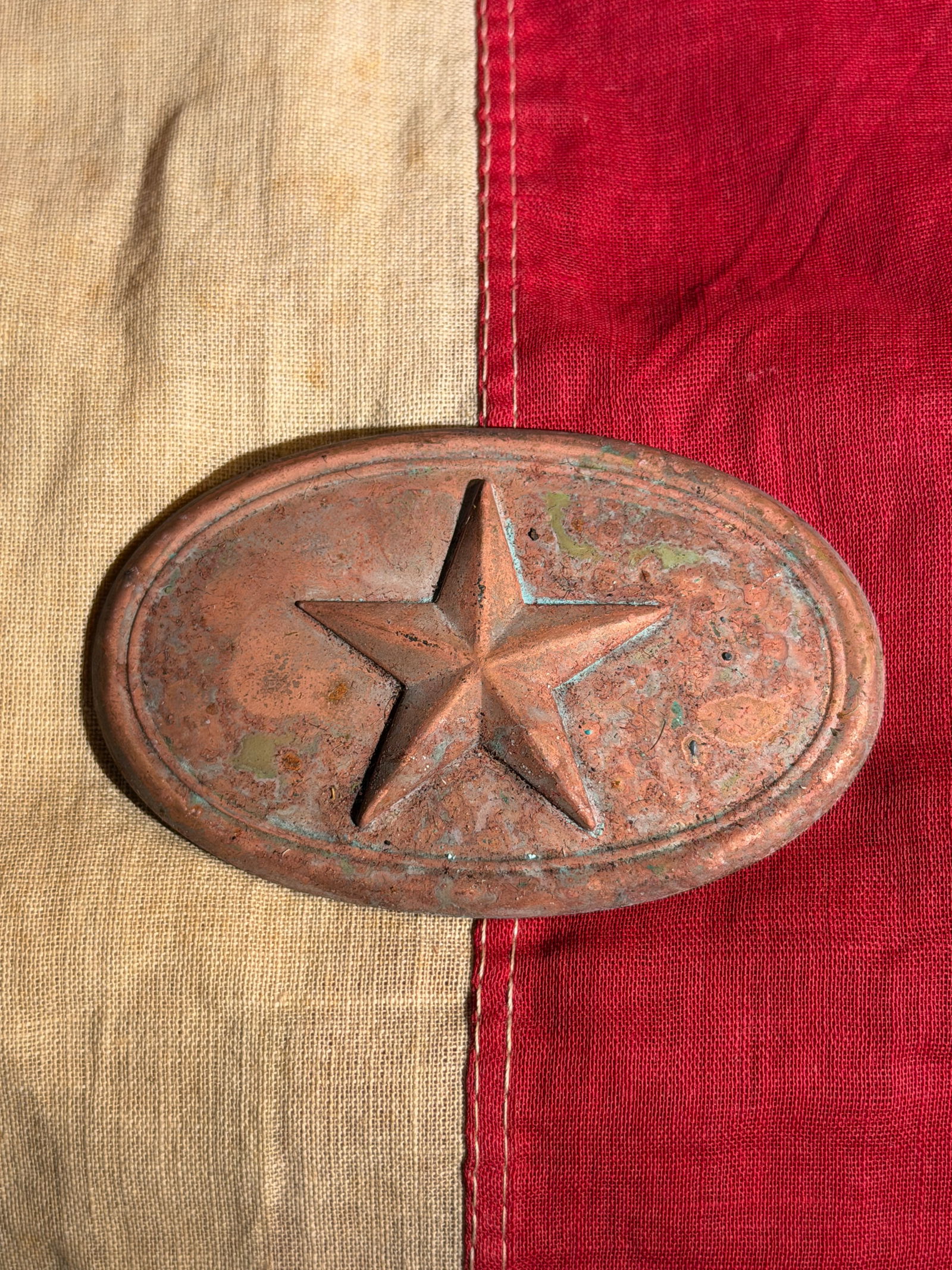 Civil War Confederate CSA Texas Star Buckle: This oval metal belt buckle features a raised five-pointed star, a prominent emblem associated with the Civil War Texas Regiment, particularly throughout War periods. The star symbol represented the S