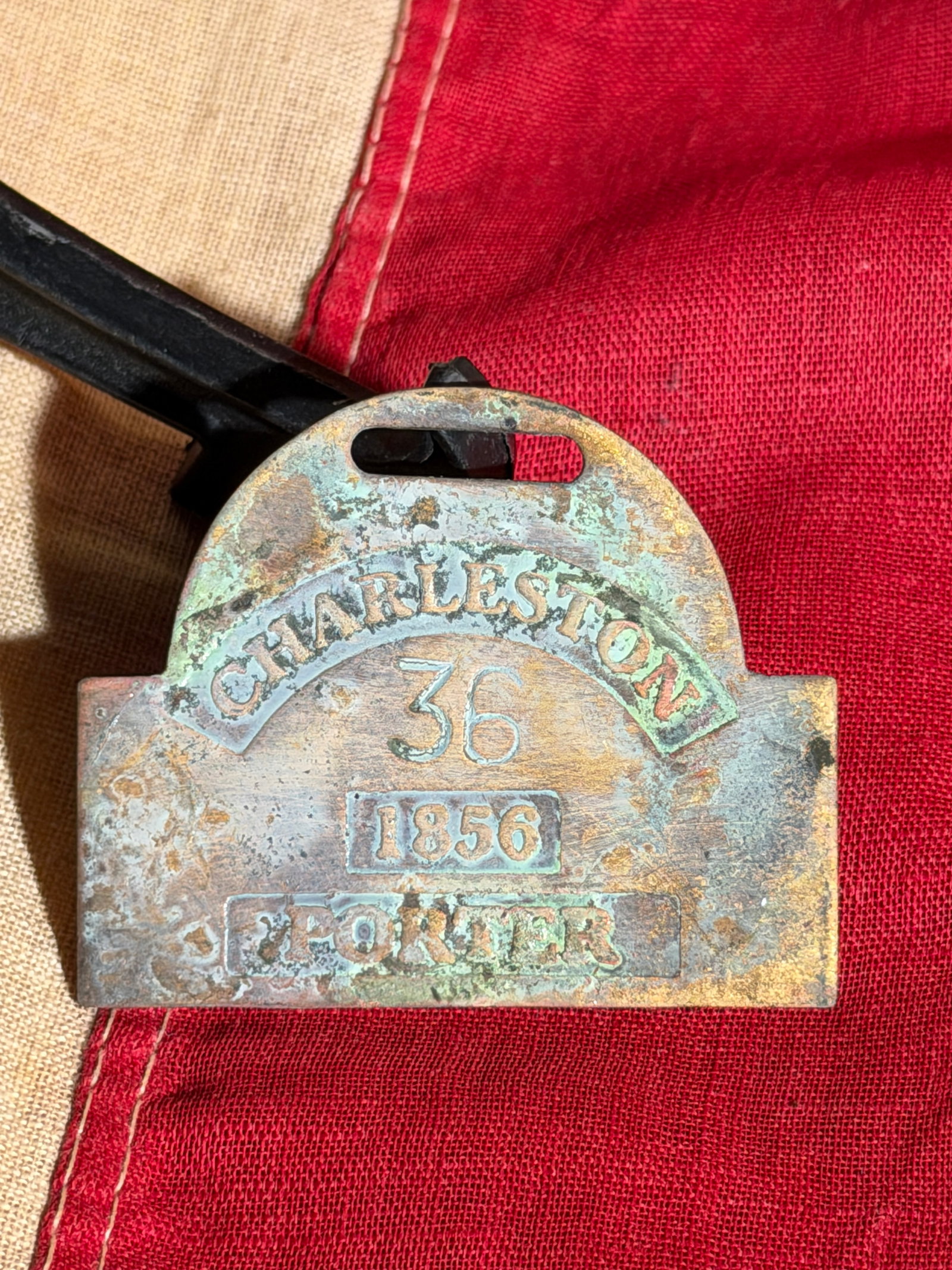 Slave Hire Badge for a Porter, Charleston, South Carolina, No. 36 (1856): This copper slave hire badge was issued in Charleston, South Carolina, in 1856 as part of the city’s regulated system governing the labor of enslaved individuals hired out for work. The badge is sta