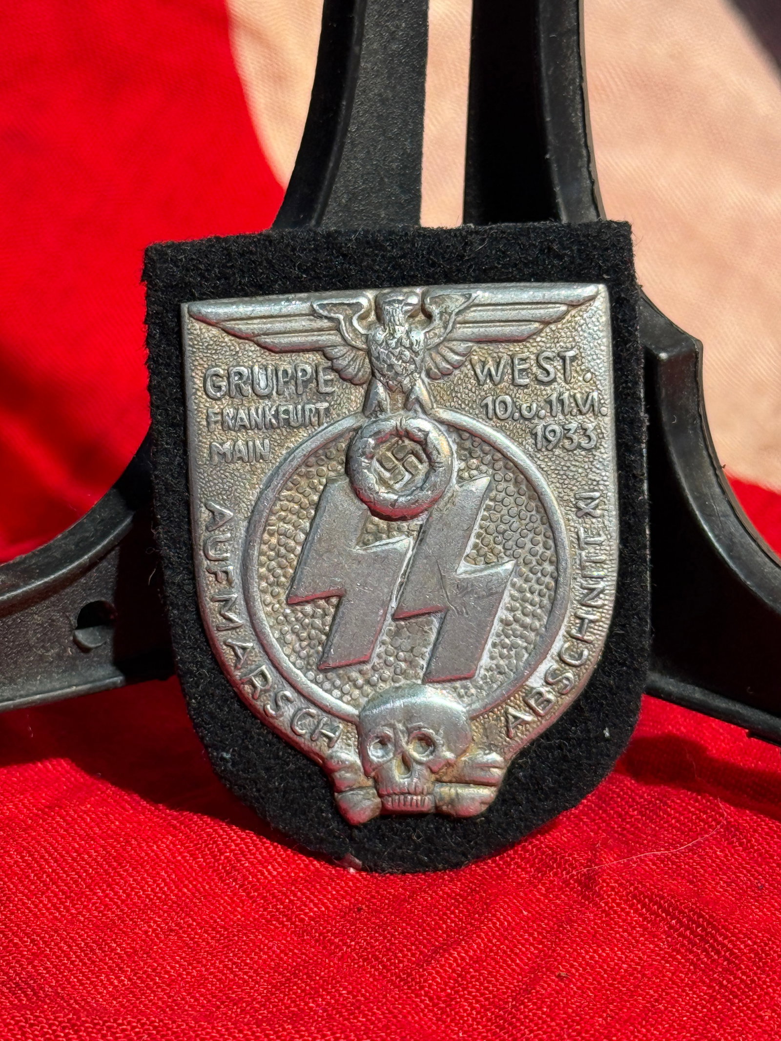 WW2 German SS “Gruppe West?? Frankfurt am Main Rally Badge (Aufmarsch Abzeichen), 10–11 June: Early National Socialist SS rally badge (tinnie) commemorating an SS Gruppe West gathering held in Frankfurt am Main on 10–11 June 1933, shortly after the Nazi seizure of power in Germany. The die-s