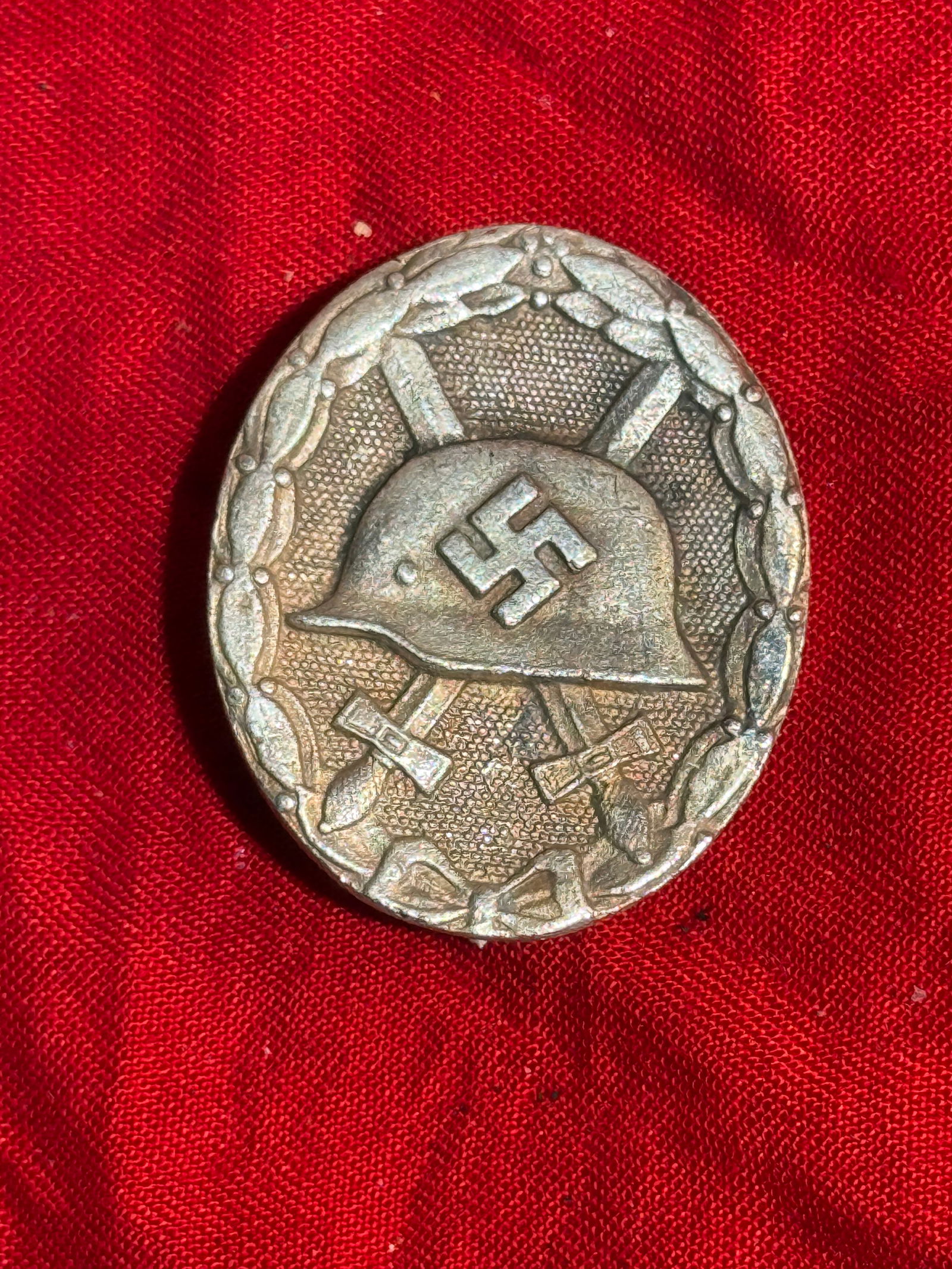 Wound Badge in Silver (Verwundetenabzeichen in Silber), Nazi Germany, World War II By RZM: German Wound Badge in Silver, instituted in 1939 as a continuation of the earlier First World War decoration awarded to soldiers wounded in combat. The oval badge depicts a German steel combat helmet
