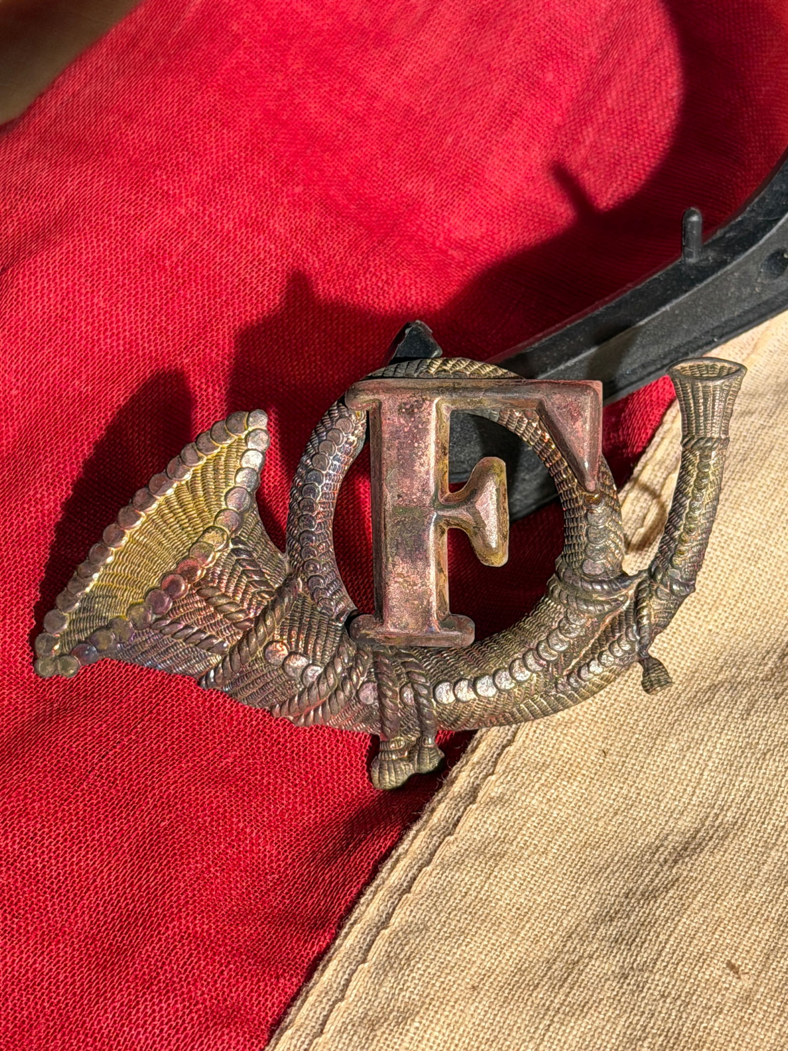 Civil War False Embroidered Infantry Headgear Badge Co. F: Civil War False Embroidered Infantry Headgear Badge Co. F. Cast brass hat insignia representing the U.S. Army Infantry branch, featuring a hunting horn (bugle) with the letter “F” centered wit