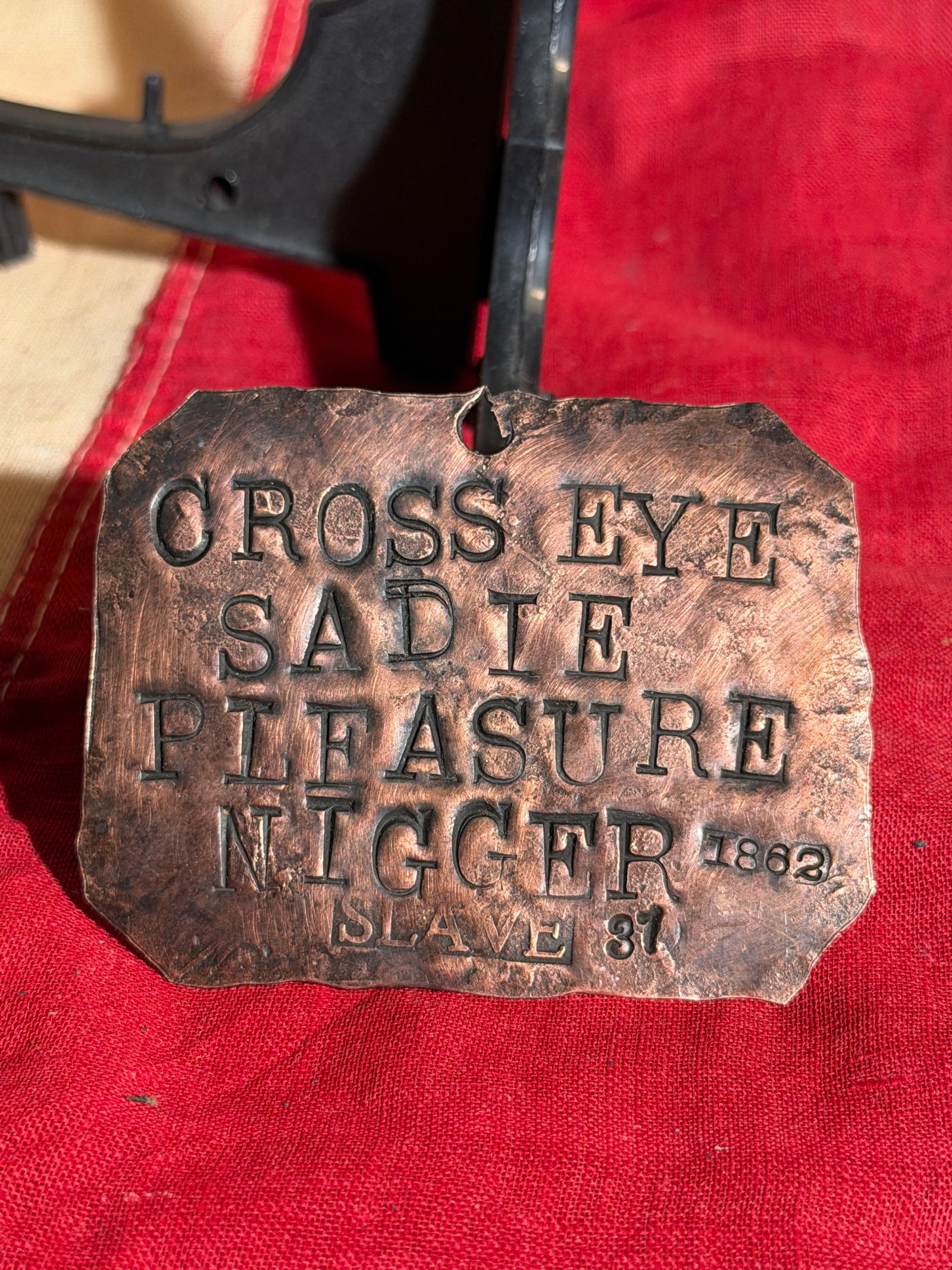1862 Slave Identification Tag Slave Tag Servant ID: Copper slave identification tag stamped “Cross Eye Sadie – Plantation – 1862 – Slave 31.” Such tags were sometimes issued on plantations to identify enslaved individuals as property and