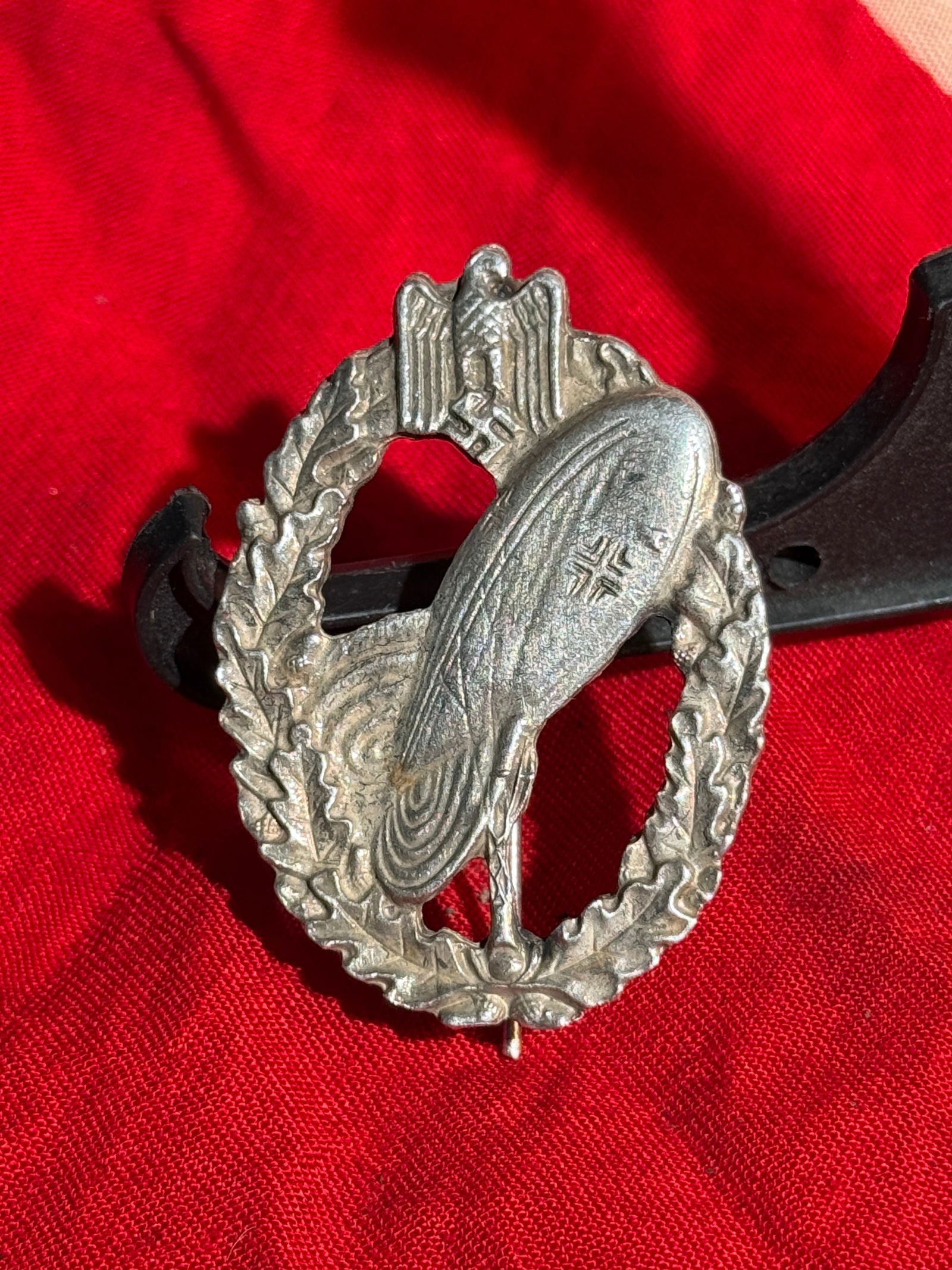 German WWII Balloon Observer’s Badge (Ballonbeobachterabzeichen), 1944 By RZM: Silver-toned metal badge depicting an observation balloon within an oak-leaf wreath, surmounted by the Luftwaffe eagle clutching a swastika. Instituted in 1944, the Balloon Observer’s Badge was awar