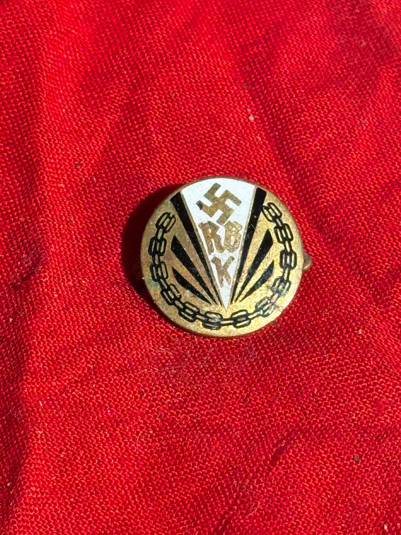 WW2 German NS-RKB (Kyffhäuserbund) Membership Badge, Third Reich Period By Ges. Gesch.: Small circular membership badge of the National Socialist War Veterans’ Association (NS-Reichskriegerbund Kyffhäuser) from the 1930s–1940s. The design features a central swastika above the letter